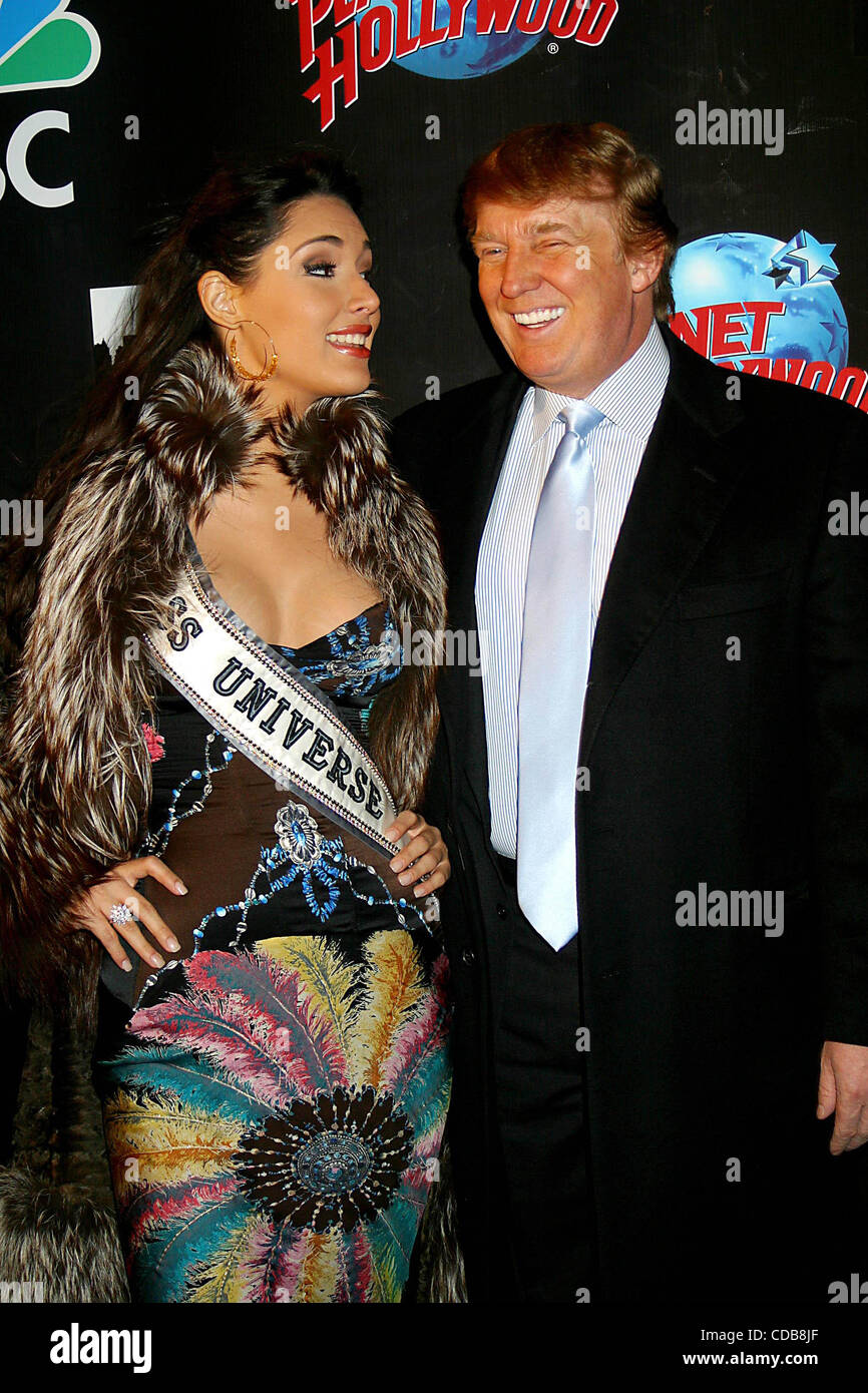 K35189JBU.THE APPRENTICE TAKES OVER THE PLANET!!.DONALD TRUMP AND FORMER  CONTESTANTS TO ATTEND VIEWING PARTY AT PLANET HOLLYWOOD IN NEW YORK New  York.1/29/2004. / 2004.MISS UNIVERSE AMELIA VEGA AND DONALD TRUMP(Credit  Image: Â©, image size:866x1390