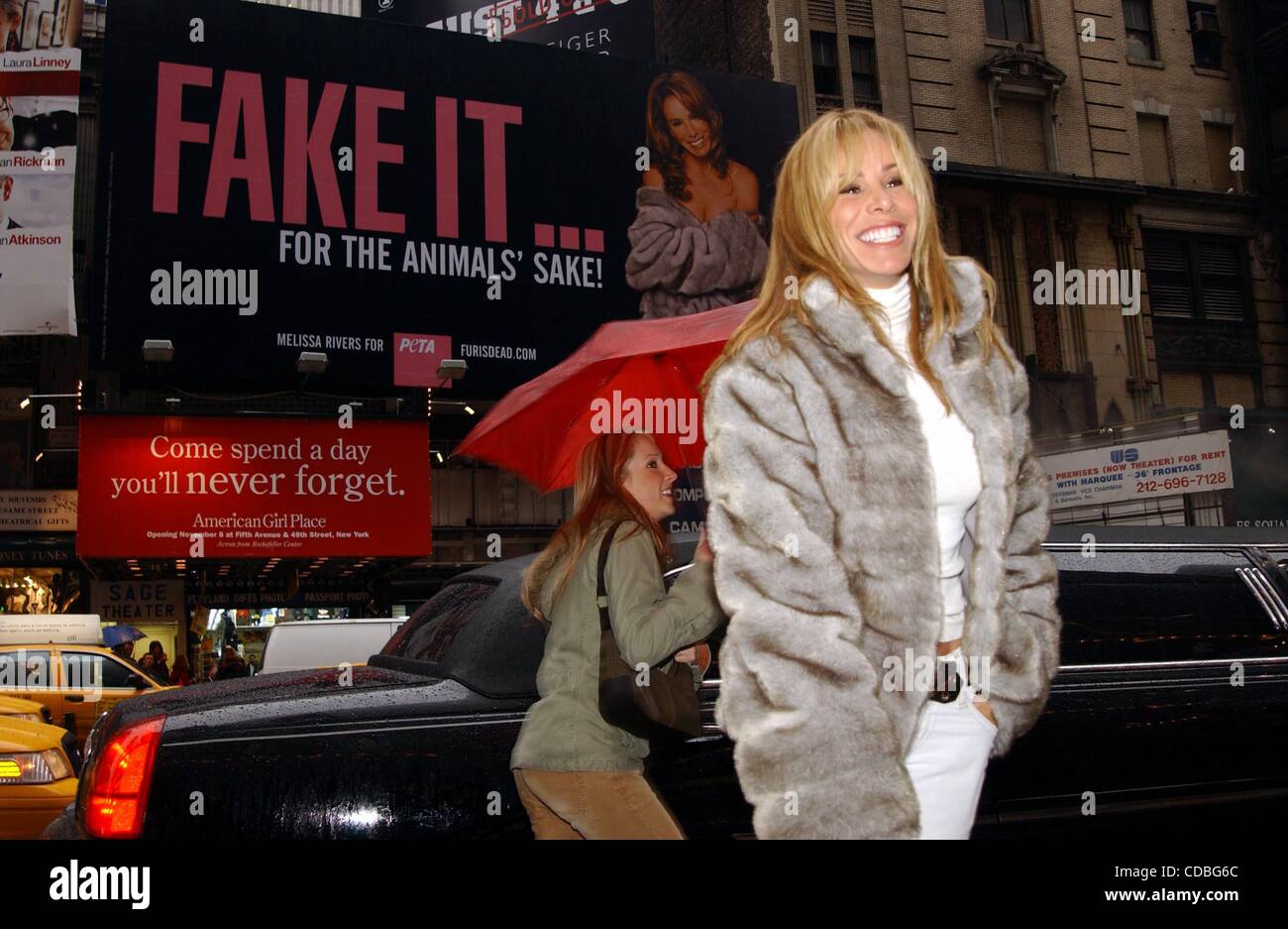 K34336AR.JOAN AND MELISSA RIVERS UNVEIL MELISSA'S NEW PETA BILLBOARD IN TIMES  SQUARE. THE BILLBOARD ENCOURAGES SHOPPERS TO WEAR ONLY FAKE FUR. TIMES  SQUARE, NEW YORK New York 11/27/2003. / MELISSA RIVERS(Credit Image: