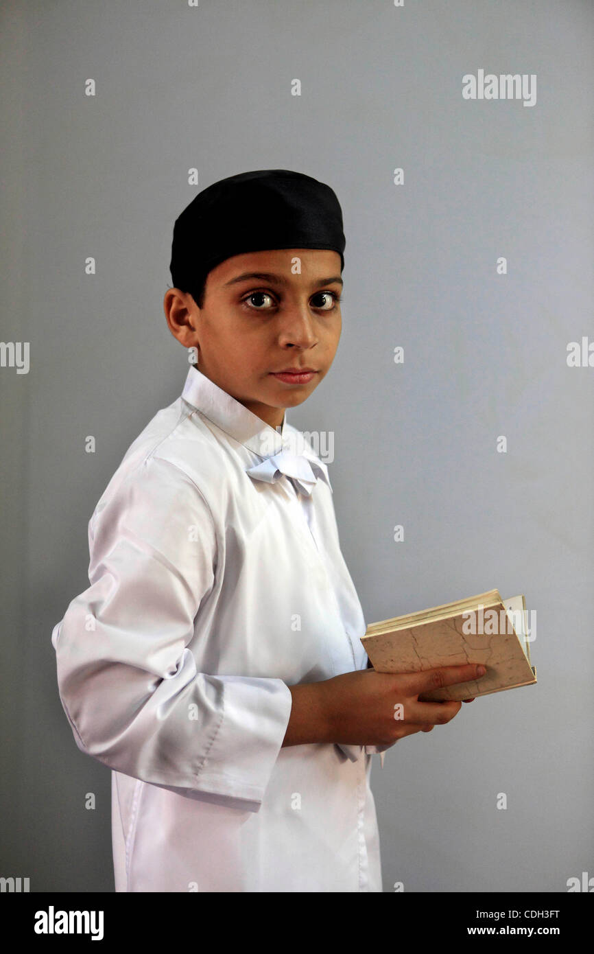 Jan 27, 2011 - Mumbai, India - 10-year-old Farhad D. Sanjana, a student of the M.F.Cama Athornan Institute at Mumbai, attends his regular classes at the School. Farhad is one of just four students attending the M.F.Cama Athornan Institute, a religious school in Mumbai which trains priests for the Pa Stock Photo