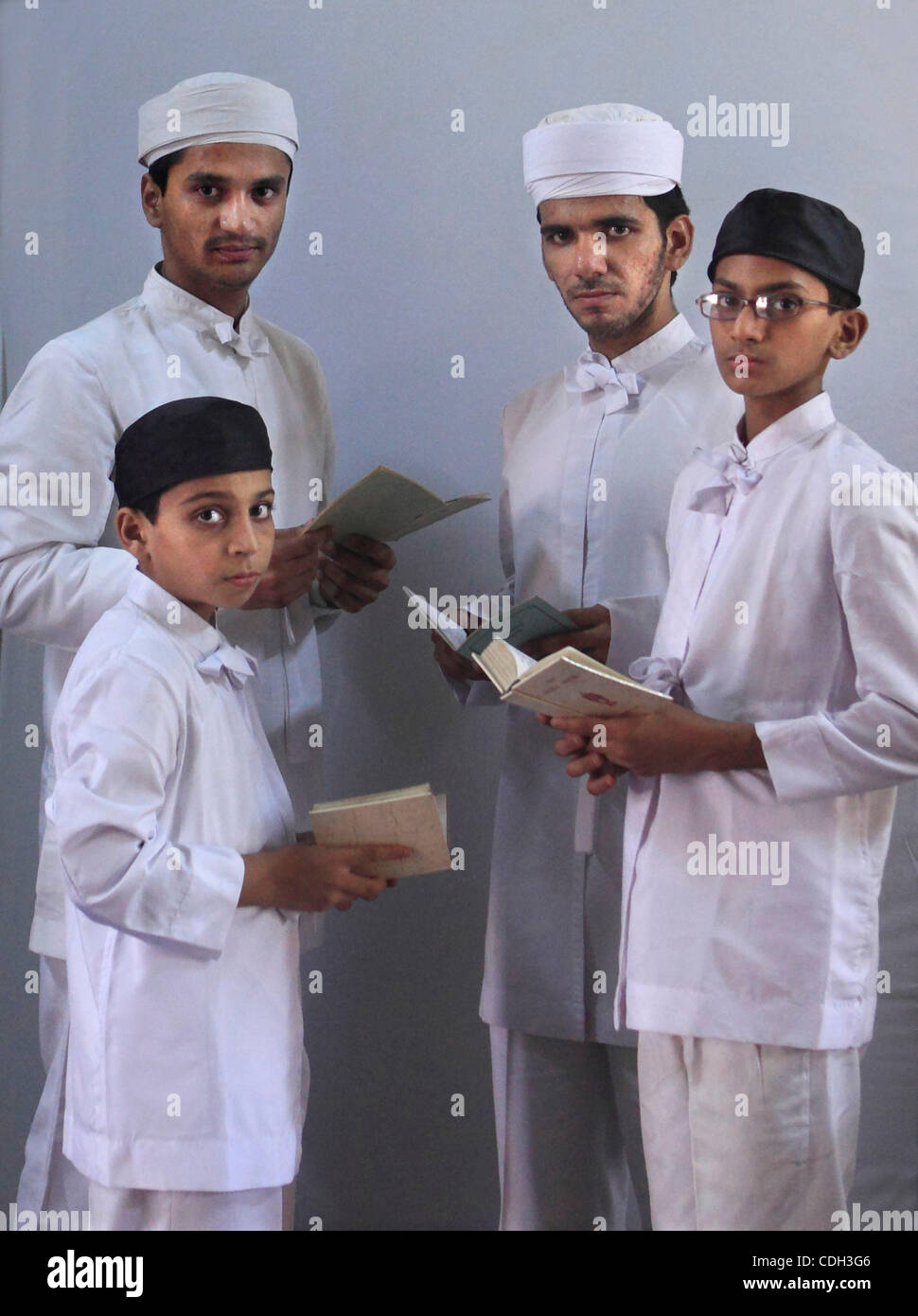 The four students of the M.F.Cama Athornan Institute at Mumbai attend  their regular classes. From front left clockwise are Farhad Sanjana,Behram,Nekshad Phatakia and Ruzan Daruwalla. Stock Photo