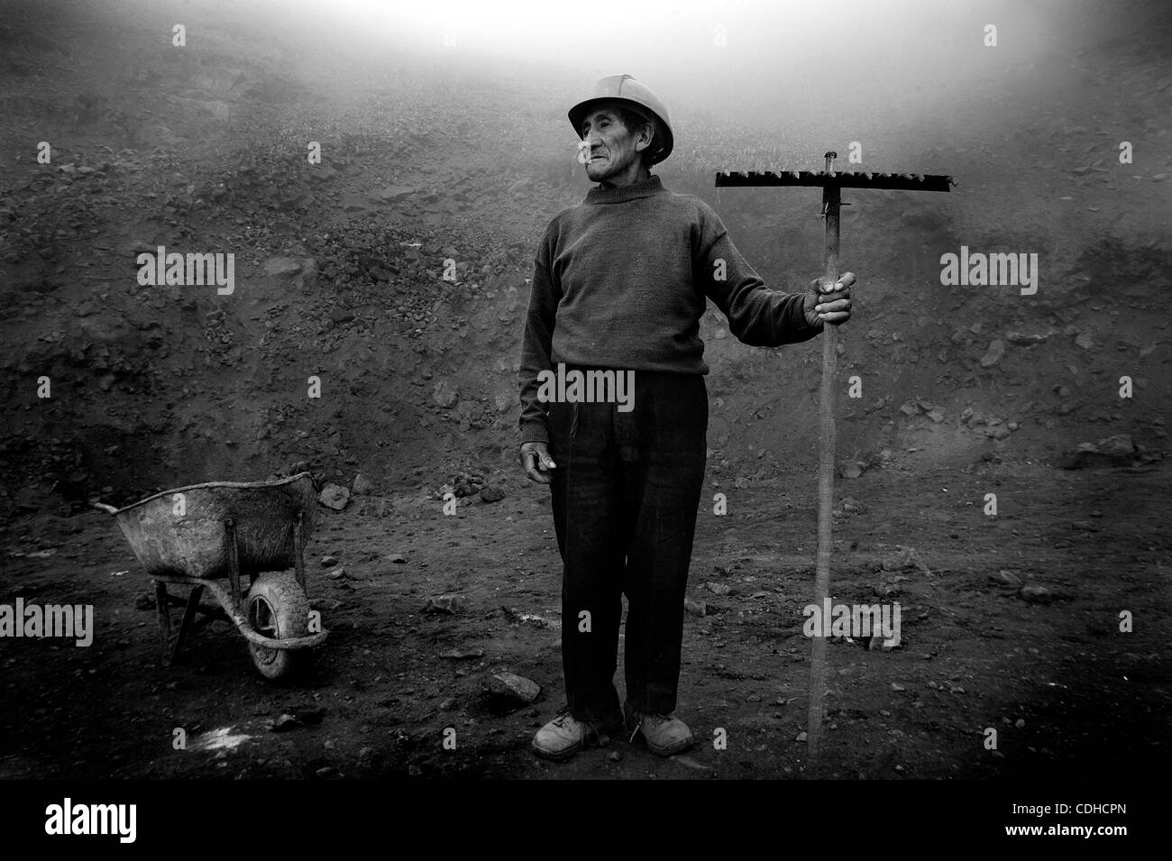 Feb. 3, 2011 - Lima, Peru - An 80 year-old man works 10hrs a day for 25 sol (about 8 dollars) building a road to the highest point in the slum of Bellevista so water can be delivered. (Credit Image: © Michael Francis McElroy/zReportage.com/ZUMA) Stock Photo