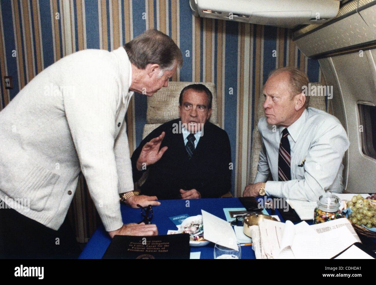 Feb. 3, 2011 - Washington, DISTRICT OF COLUMBIA, U.S. - (FILE) A file picture dated 10 October 1981 shows former US presidents Jimmy Carter (L), Richard M. Nixon (C) and Gerald R. Ford (R) aboard a airplane flying to attend the funeral of slain Egyptian President Anwar al Sadat in Cairo, Egypt. (Cre Stock Photo