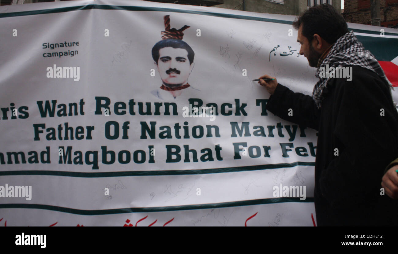 Feb 4, 2011 - Srinagar, Kashmir, India - JKLF Chairman JAVEED MIR signs a banner during a JKLF (Jammu and Kashmir Liberation Front) protest. The signature campaigning was launched by the group demanding the removal of the remains of its founder Muhammad Maqbool Bhat, who was sent to gallows on Febru Stock Photo