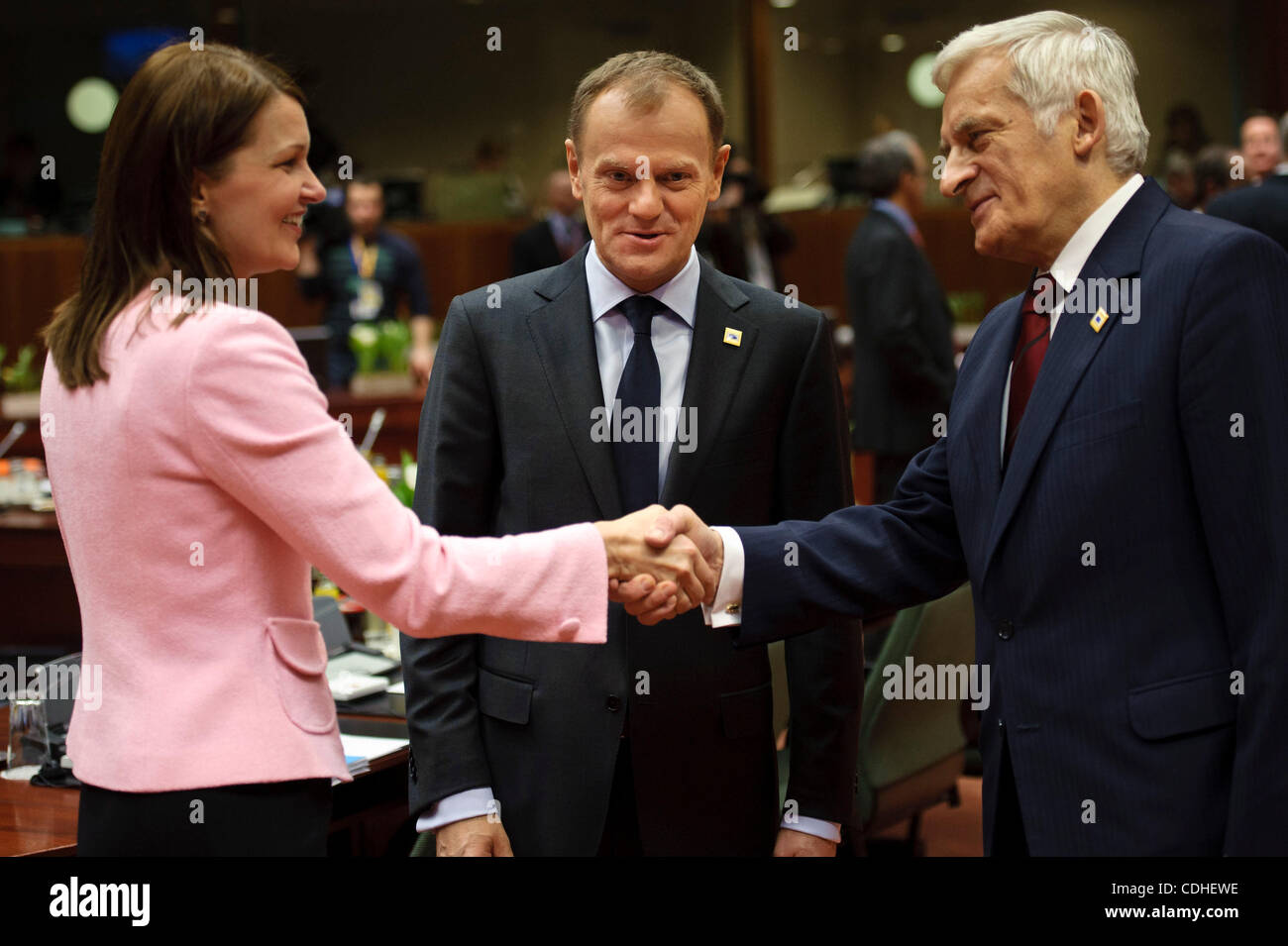 Feb. 4, 2011 - Brussels, BXL, Belgium - Poland's Prime Minister Donald Tusk (C) talks with Finnish Prime Minister Mari Kiviniemi and European Parliament President Jerzy Buzek (R)   prior to the  European Union head of states summit at European Councill headquarters in Brussels, Belgium on 2011-02-04 Stock Photo