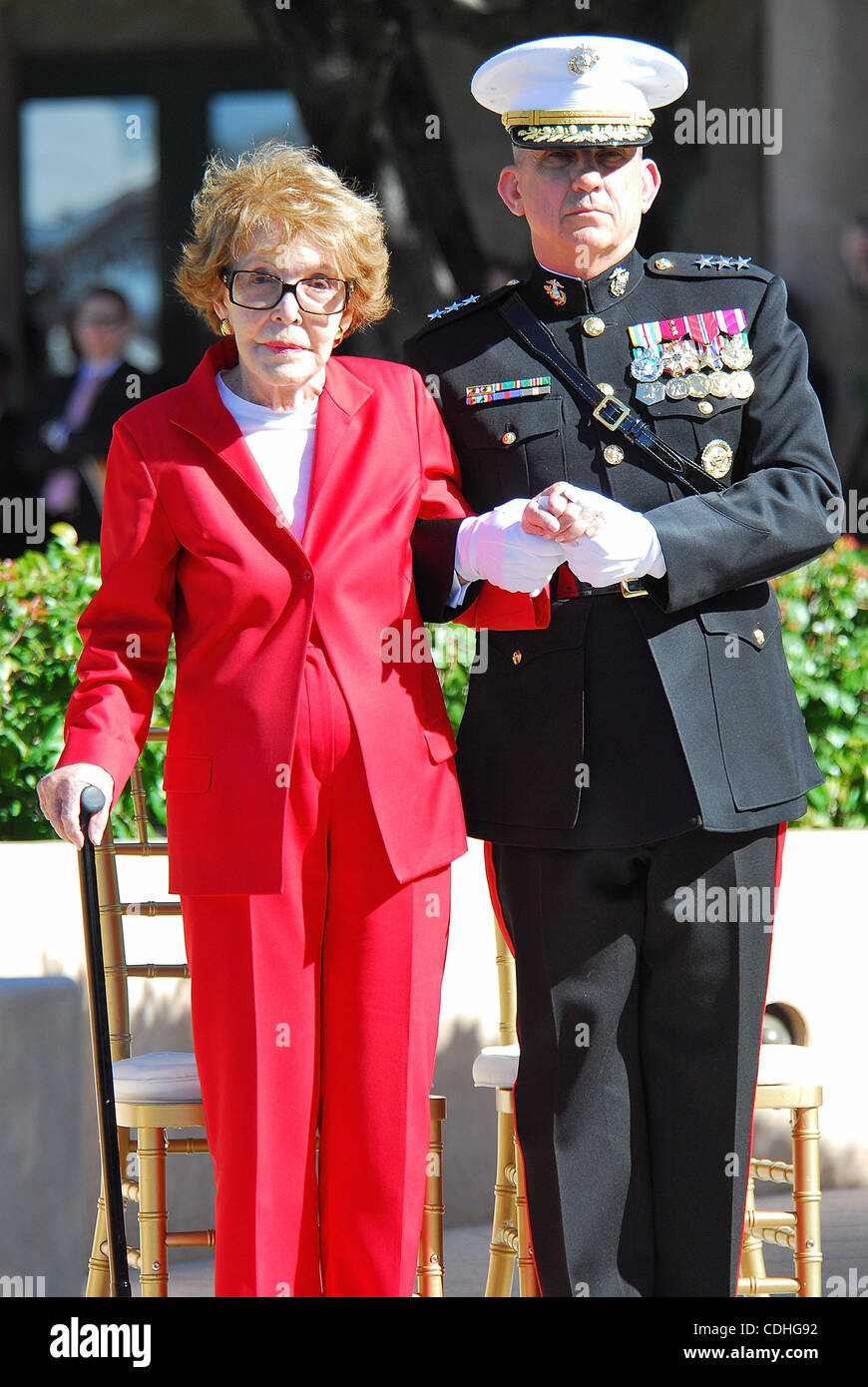 Feb. 6, 2011 - Simi Valley, California, U.S. - Former US first lady NANCY REAGAN is escorted by Marine Corps Lieutenant General GEORGE J. FLYNN as she arrives at the memorial site which serves as her husband's final resting place to lay a wreath during the centennial birthday celebration for former  Stock Photo