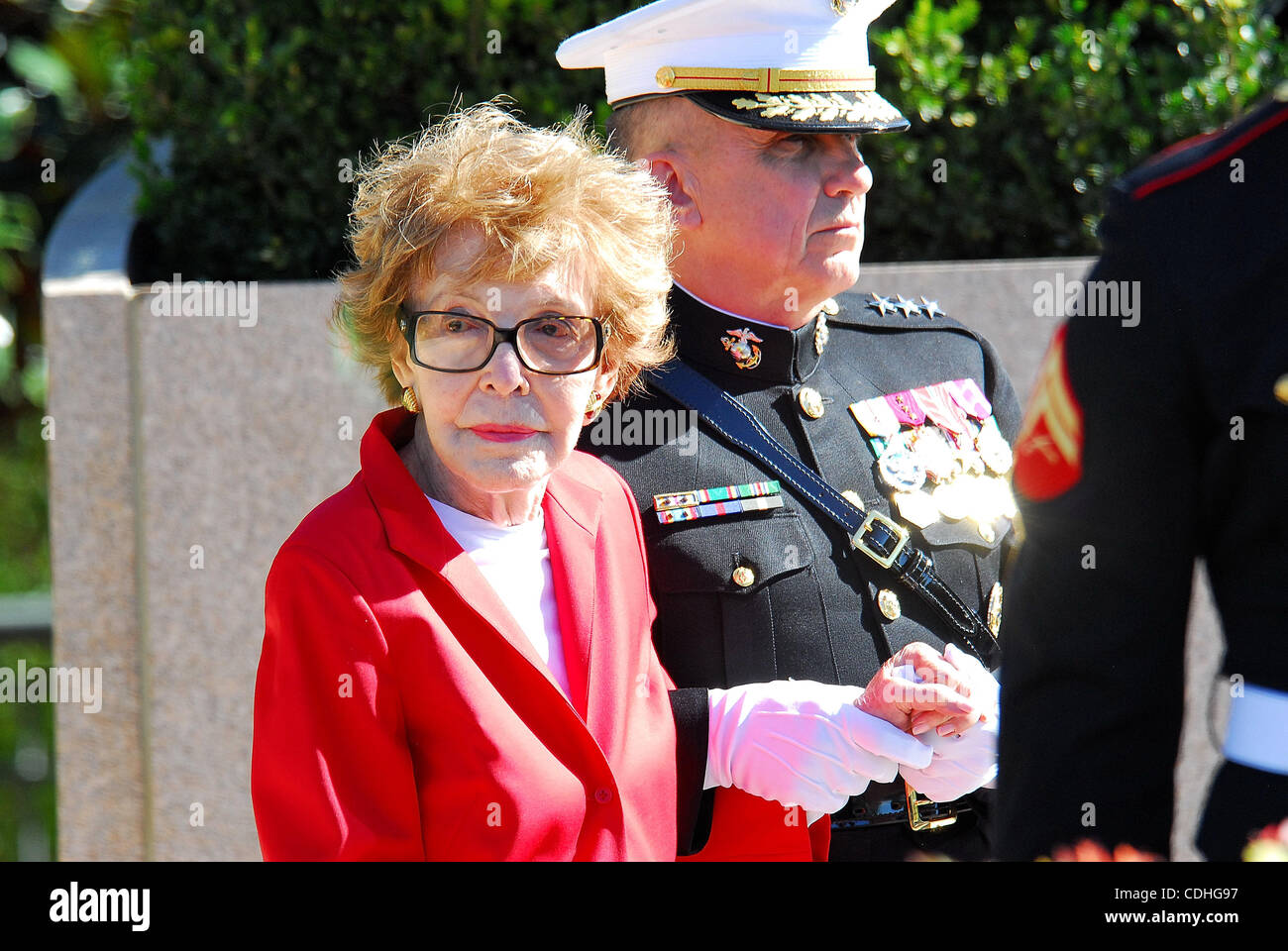 Feb. 6, 2011 - Simi Valley, California, U.S. - Former US first lady NANCY REAGAN is escorted by Marine Corps Lieutenant General GEORGE J. FLYNN as she arrives at the memorial site which serves as her husband's final resting place to lay a wreath during the centennial birthday celebration for former  Stock Photo