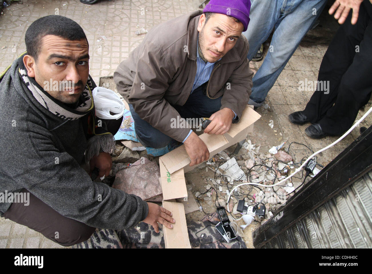 February 7, 2011; Cairo, Egypt. A group of men use one of the very few