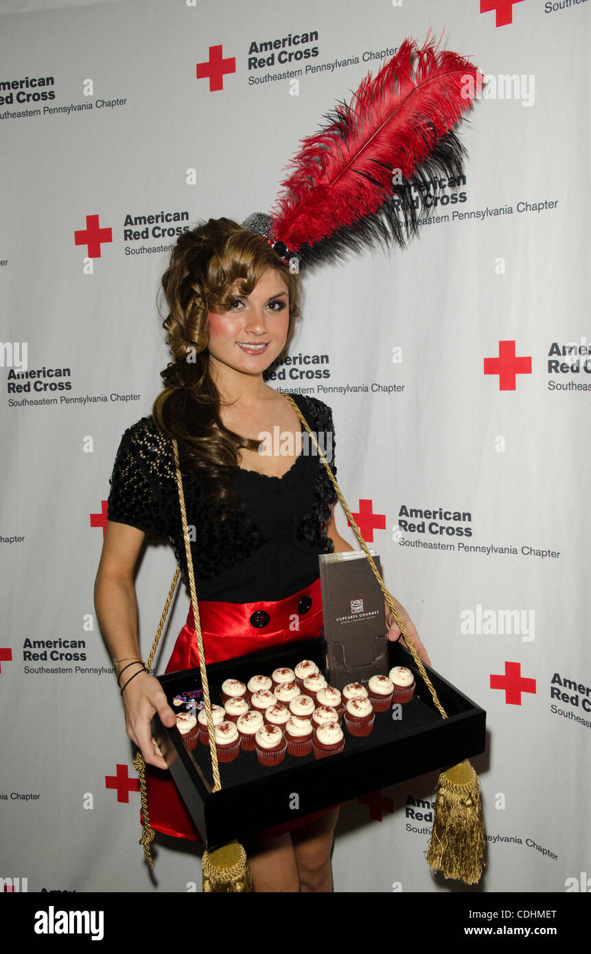 Feb.9th 2011, Philadelphia PA-USA-JACQUELINE TRENHOLM of the Creative Juice Group, serves up red velvet cupcakes at the Red Cross Red Ball preview party held at the Chestnut Club in Philadelphia. The 2011 Red Ball Gala will feature Vin Diesel as the celebrity Host. (Credit Image: (c) Ricky Fitchett/ Stock Photo