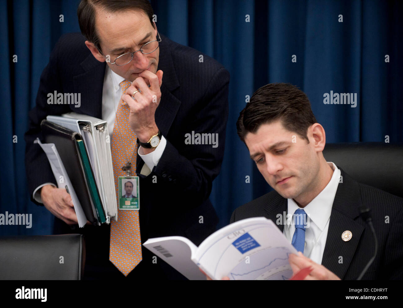 Feb 10, 2011 - Washington, District of Columbia, U.S. - House Budget Committee Chairman Rep. PAUL RYAN (R-WI) looks over the Congressional Budget Office's Budget and Economic Outlook Report before hearing testimony from CBO Director Elmendorf on Thursday. (Credit Image: © Pete Marovich/ZUMAPRESS.com Stock Photo