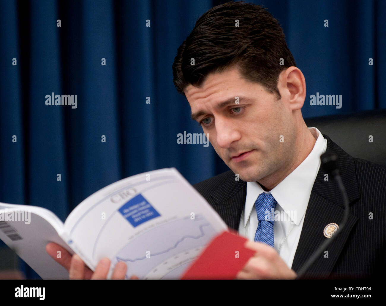 Feb 10, 2011 - Washington, District of Columbia, U.S. - House Budget Committee Chairman Rep. PAUL RYAN (R-WI) looks over the Congressional Budget Office's Budget and Economic Outlook Report before hearing testimony from CBO Director Elmendorf on Thursday. (Credit Image: © Pete Marovich/ZUMAPRESS.com Stock Photo