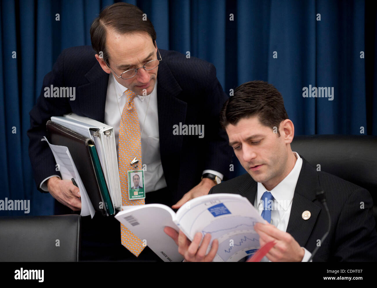 Feb 10, 2011 - Washington, District of Columbia, U.S. - House Budget Committee Chairman Rep. PAUL RYAN (R-WI) looks over the Congressional Budget Office's Budget and Economic Outlook Report before hearing testimony from CBO Director Elmendorf on Thursday. (Credit Image: © Pete Marovich/ZUMAPRESS.com Stock Photo