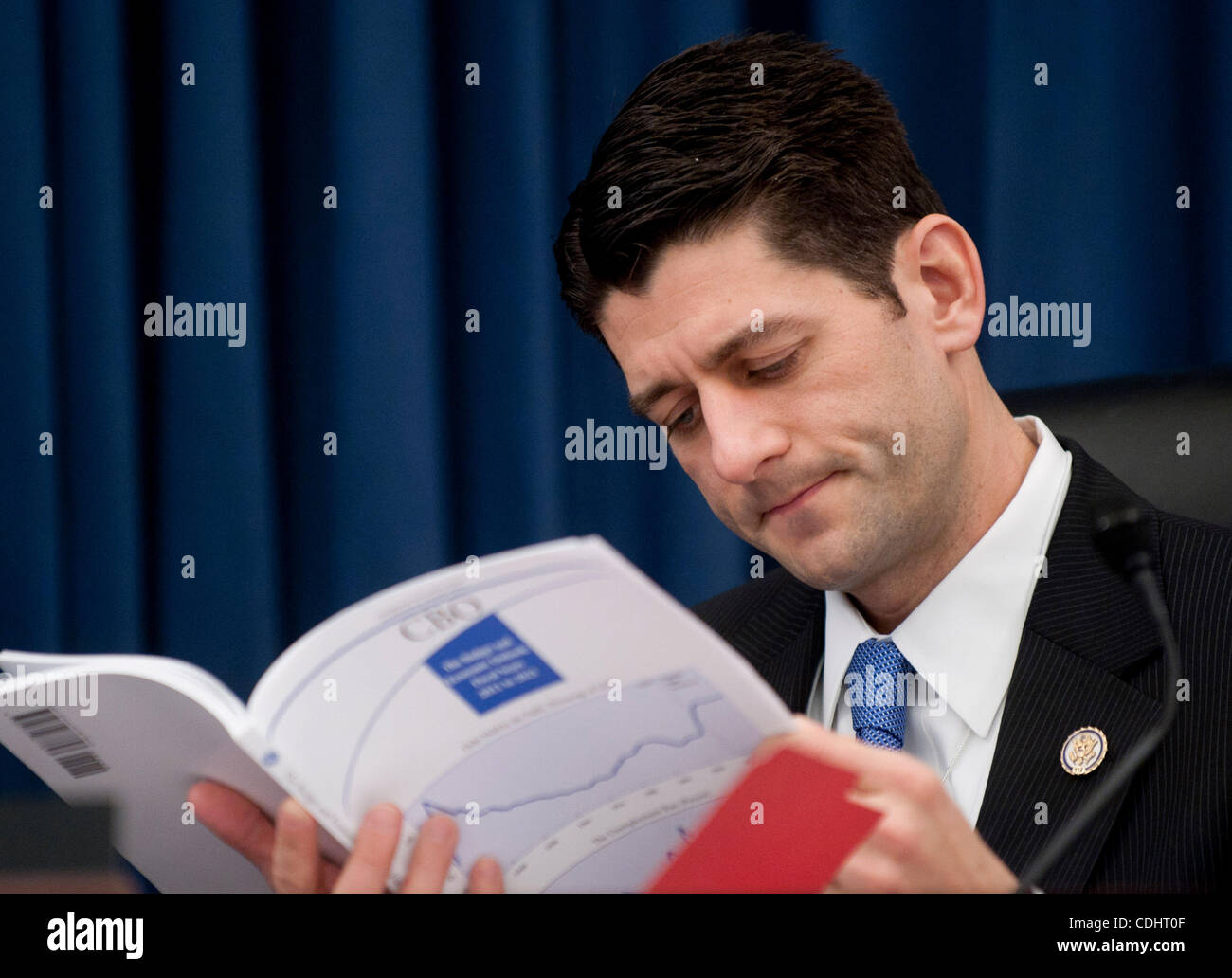 Feb 10, 2011 - Washington, District of Columbia, U.S. - House Budget Committee Chairman Rep. PAUL RYAN (R-WI) looks over the Congressional Budget Office's Budget and Economic Outlook Report before hearing testimony from CBO Director Elmendorf on Thursday. (Credit Image: © Pete Marovich/ZUMAPRESS.com Stock Photo