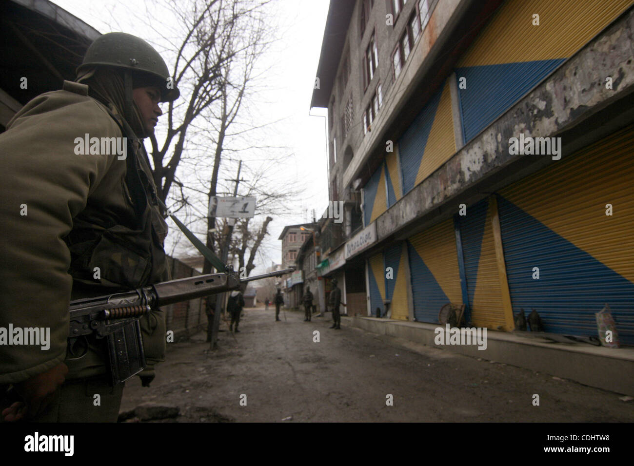 Feb 11, 2011 - Srinagar, Kashmir, India - Indian Central Reserve Police Force (CRPF) soldiers stand guard during a one day strike to mark the 27th death anniversary of Jammu and Kashmir Liberation Front (JKLF) founder Maqbool Bhat in Srinagar the summer capital of Indian Kashmir. Kashmiri seperatist Stock Photo