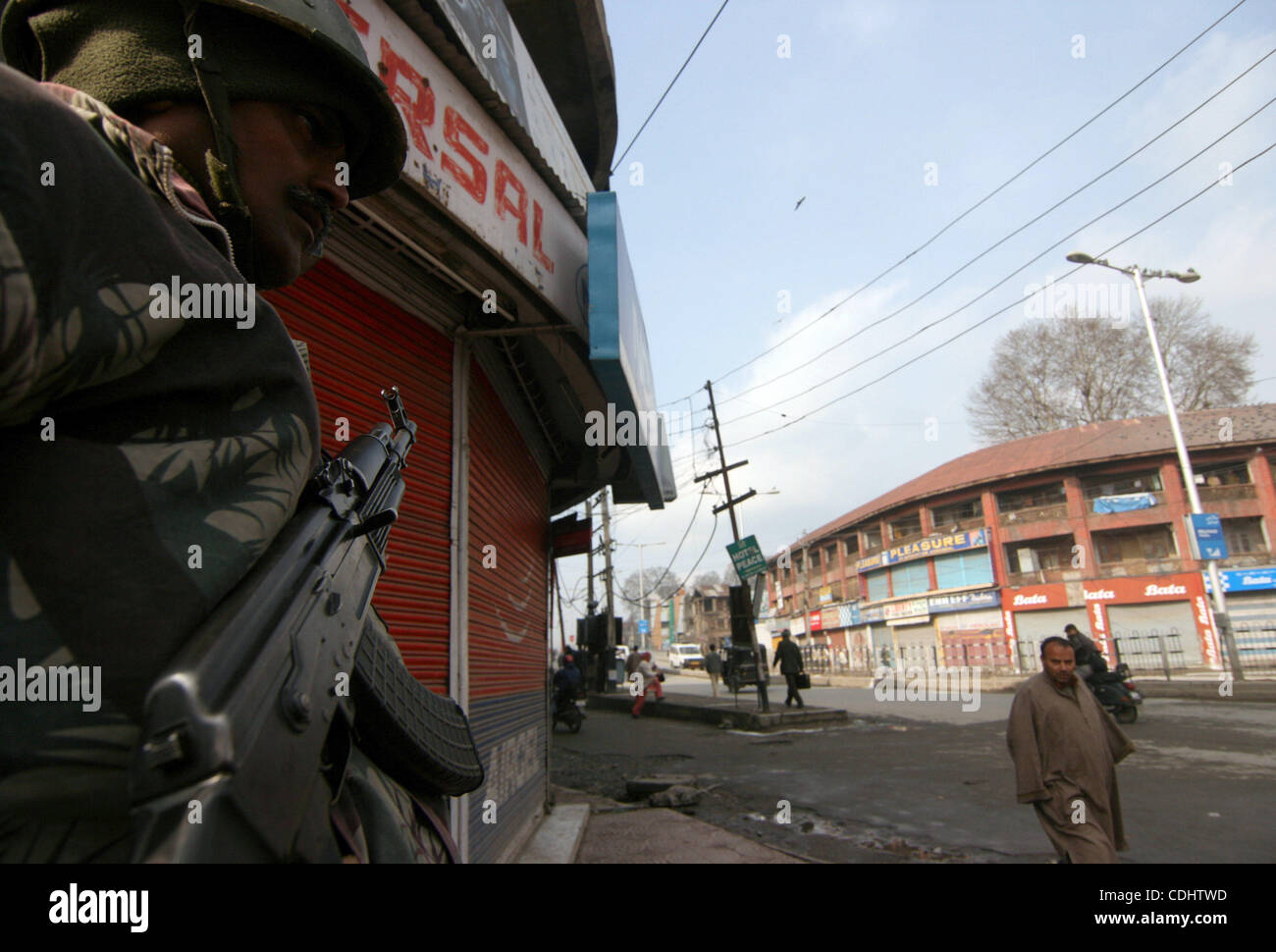 Feb 11, 2011 - Srinagar, Kashmir, India - Indian Central Reserve Police Force (CRPF) soldiers stand guard during a one day strike to mark the 27th death anniversary of Jammu and Kashmir Libration Front (JKLF) founder Maqbool Bhat in Srinagar the summer capital of Indian Kashmir. Kashmiri seperatist  Stock Photo