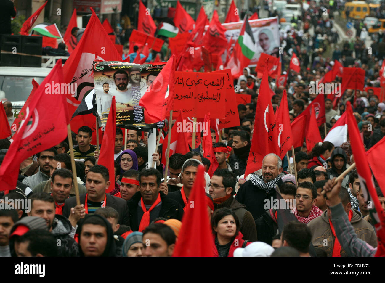 Palestinians wave red flags during a demonstration marking the 29th ...