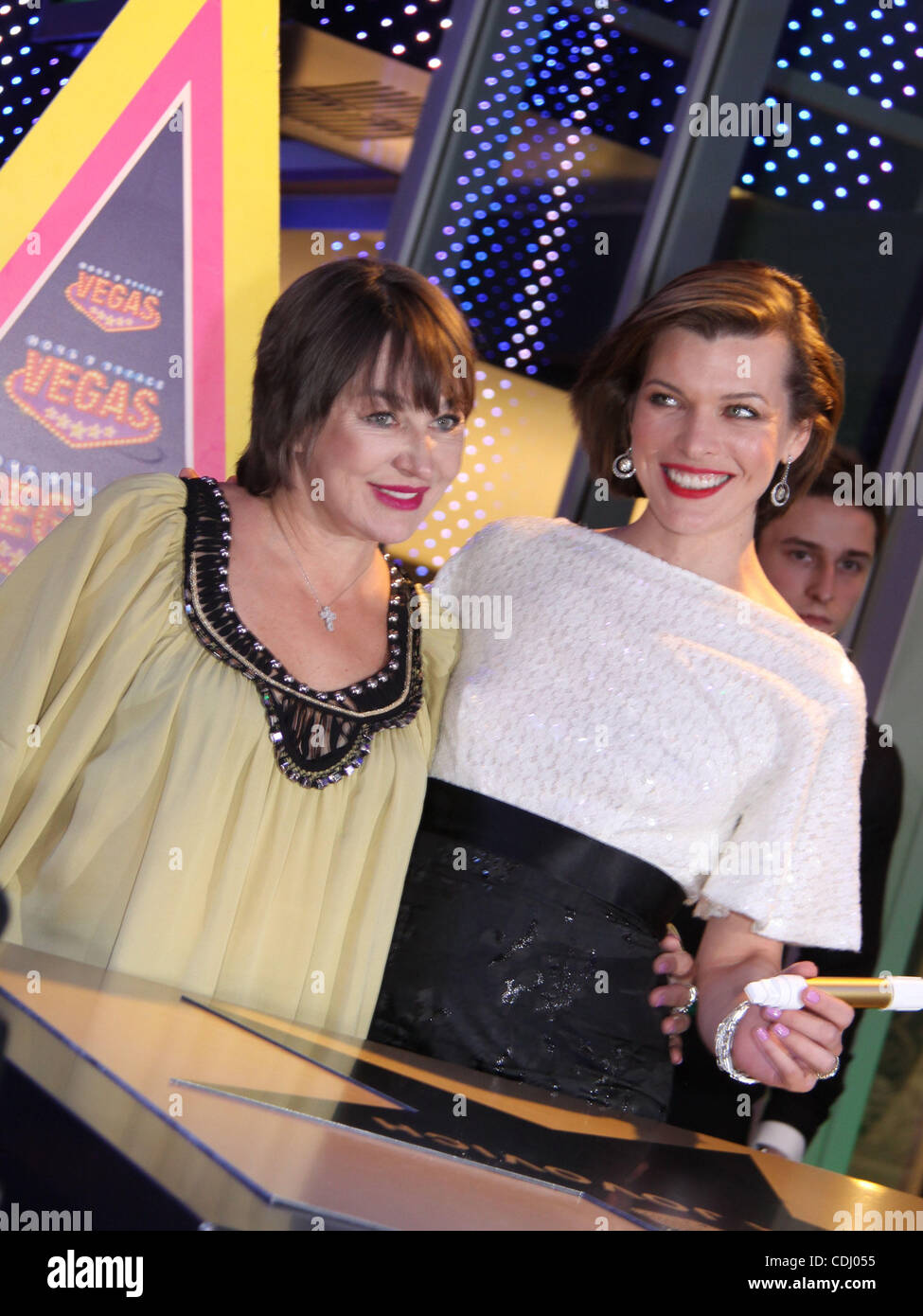 American actress Milla Jovovich with her mother Galina Loginova (l) attending the Walk of Fame Star opening ceremony at Vegas entertainment centre of Moscow . Stock Photo