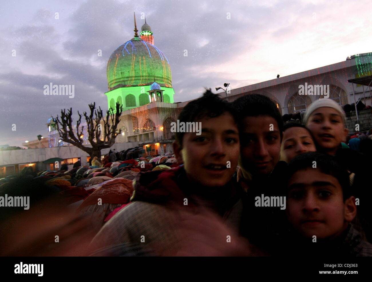 Feb 15, 2011 - Srinagar, Kashmir, India - Kashmiri muslim children celebrated as devotees pray at Dargah Hazratbal in Srinagar. People thronged to thousands of mosques and religious places, which were specially decorated, in Kashmir to offer prayers on the eve of birth anniversary of Prophet Mohamme Stock Photo