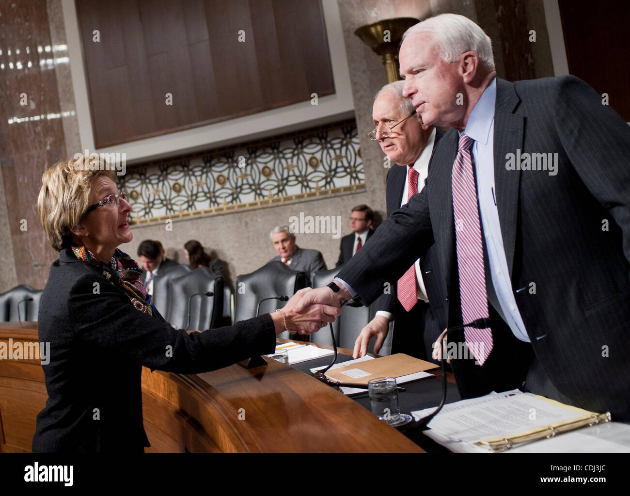 Feb 15, 2011 - Washington, District of Columbia, U.S. - Senators CARL LEVIN (D-MI) and JOHN MCCAIN (R-AZ) greet Dr. JO ANN ROONEY before a Senate Armed Services Committee Hearing her nomination to serve as Principal Deputy Undersecretary of Defense for Personnel and Readiness. (Credit Image: © Pete  Stock Photo