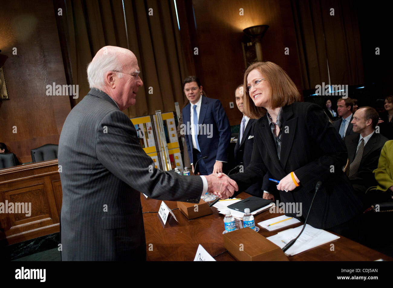 Feb 16, 2011 - Washington, District of Columbia, U.S. - Senator PATRICK LEAHY (D-VT) greets Christine Jones, general counsel and corporate secretary of The Go Daddy Group Inc. before a Senate Judiciary Committee hearing on ''Targeting Websites Dedicated To Stealing American Intellectual Property. (C Stock Photo
