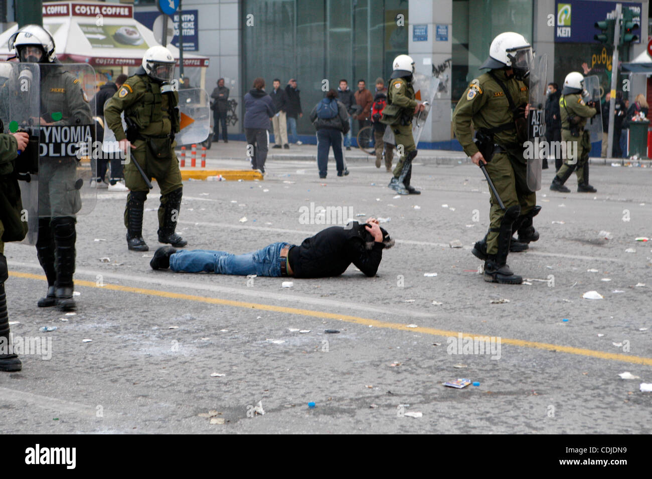 Feb. 23, 2011 - Protesters clash with the riot police outside of the Greek Parliament. Police throwed tear gas and protesters fire bombs. Thousands of people protest against government's planned austerity measures. (Credit Image: © Aristidis Vafeiadakis/ZUMAPRESS.com) Stock Photo