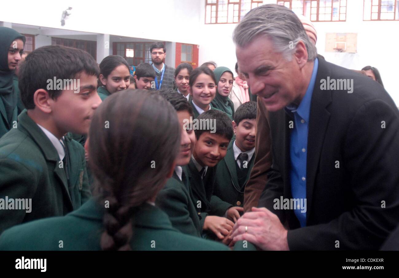 Mar 18, 2011 - Srinagar, Kashmir, India - U. S. ambassador to India TIMOTHY J. ROEMER talking with Kashmiri muslim students during a visit to a school on the outskirts of Srinagar, the summer capital of Indian Kashmir. Roemer arrived in the troubled Kashmir region on Thursday for a two-day official  Stock Photo