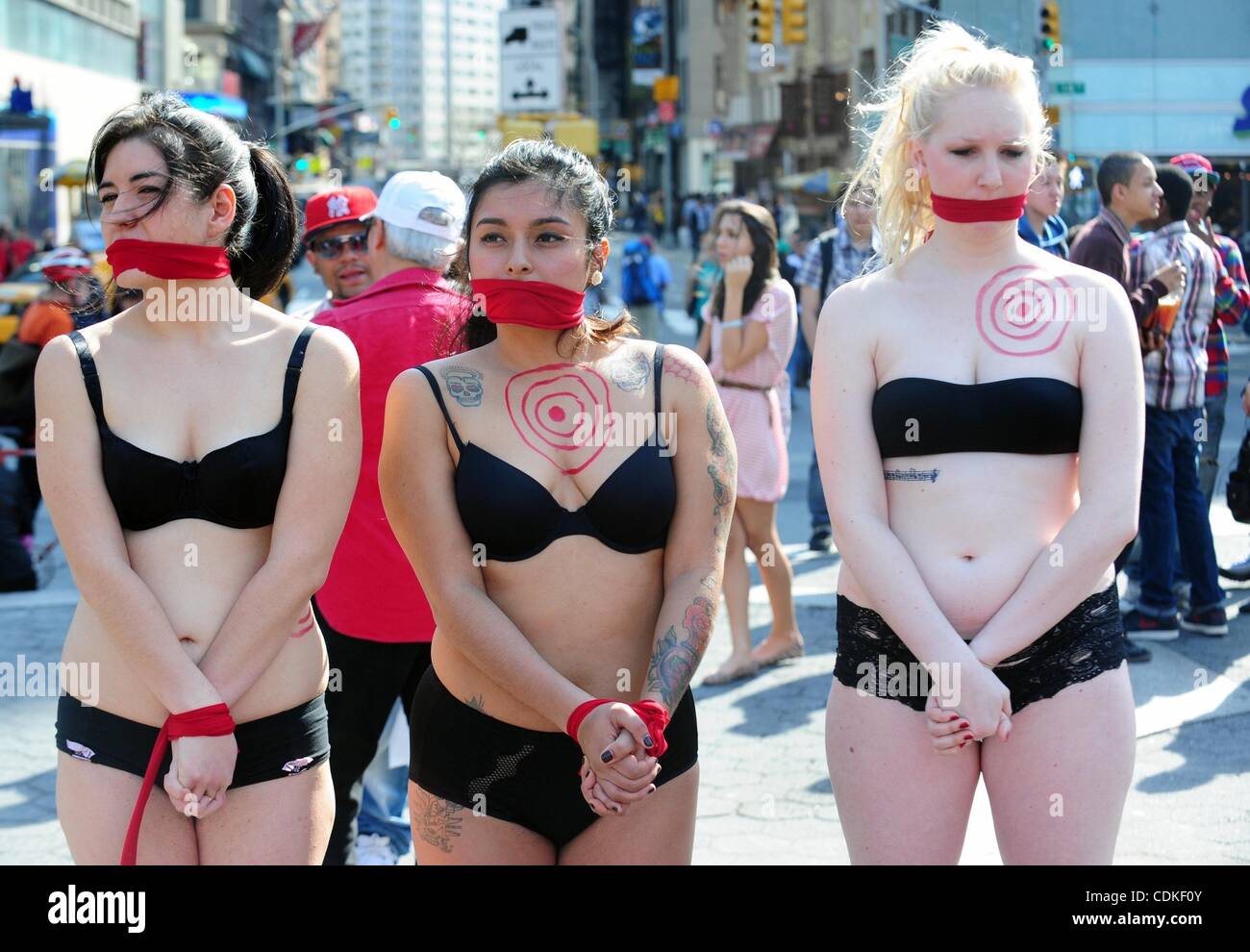 Mar. 18, 2011 - Manhattan, New York, U.S. - Female sex worker advocates  stand silently gagged and bound in Union Square to raise awareness of  United Nation's recommendation #86* which condemns violence