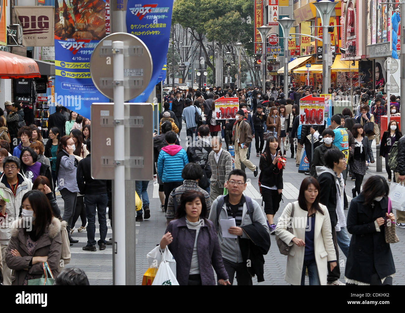 Mar. 20, 2011 - Tokyo, Japan - People walk on shopping street in Tokyo,  Japan. As one week has past since the big earthquake that hit Northern  Japan, it is affecting the