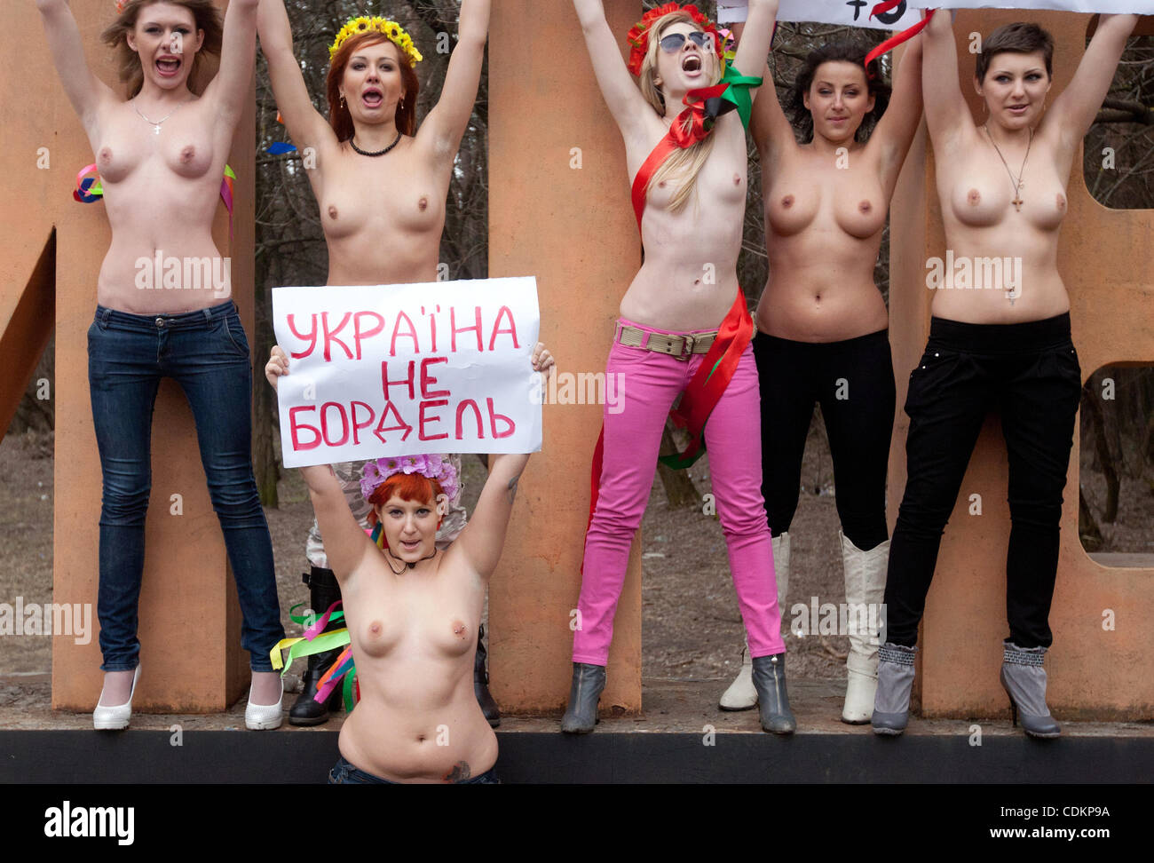 Mar 24, 2011 - Kiev, Ukraine - FEMEN activists hold a placard that reads 'Ukraine Is Not A Brothel' as Ukrainian women's movement FEMEN held a protest action for EURO 2012 Football Championship Without Prostitution. Ukraine is one of the two countries that will host the EURO 2012 Football Championsh Stock Photo