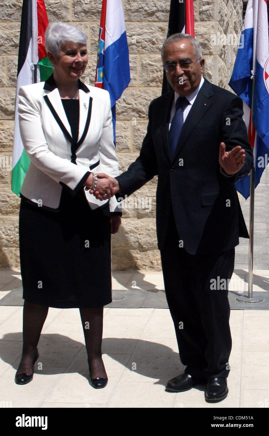 Palestinian Prime Minister Salam Fayyad and  his Croatian counterpart Jadranka Kosor attend a joint press conference after their meeting in the West Bank city of Ramallah, on March 31, 2011. Photo by Issam Rimawi Stock Photo