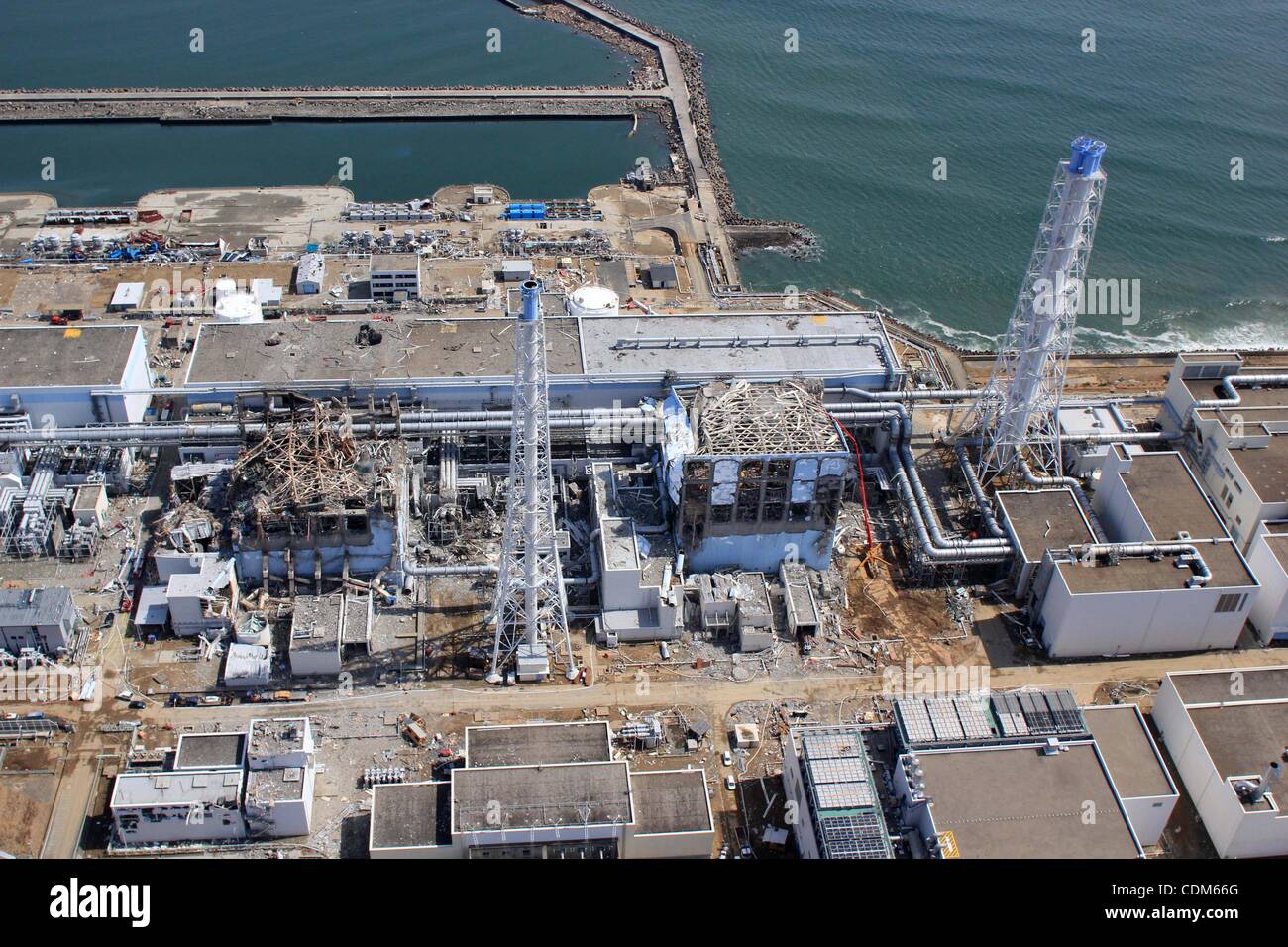 Mar. 31, 2011 - Okuma, Japan - In this handout picture dated March 24 2011 taken by Air Photo Service's unmanned aircraft Fukushima Daiichi nuclear plant of Tokyo Electric Power Company (TEPCO) is pictured. TEPCO announced that 10,000 times the amount of iodine full-limit for water is found from the Stock Photo
