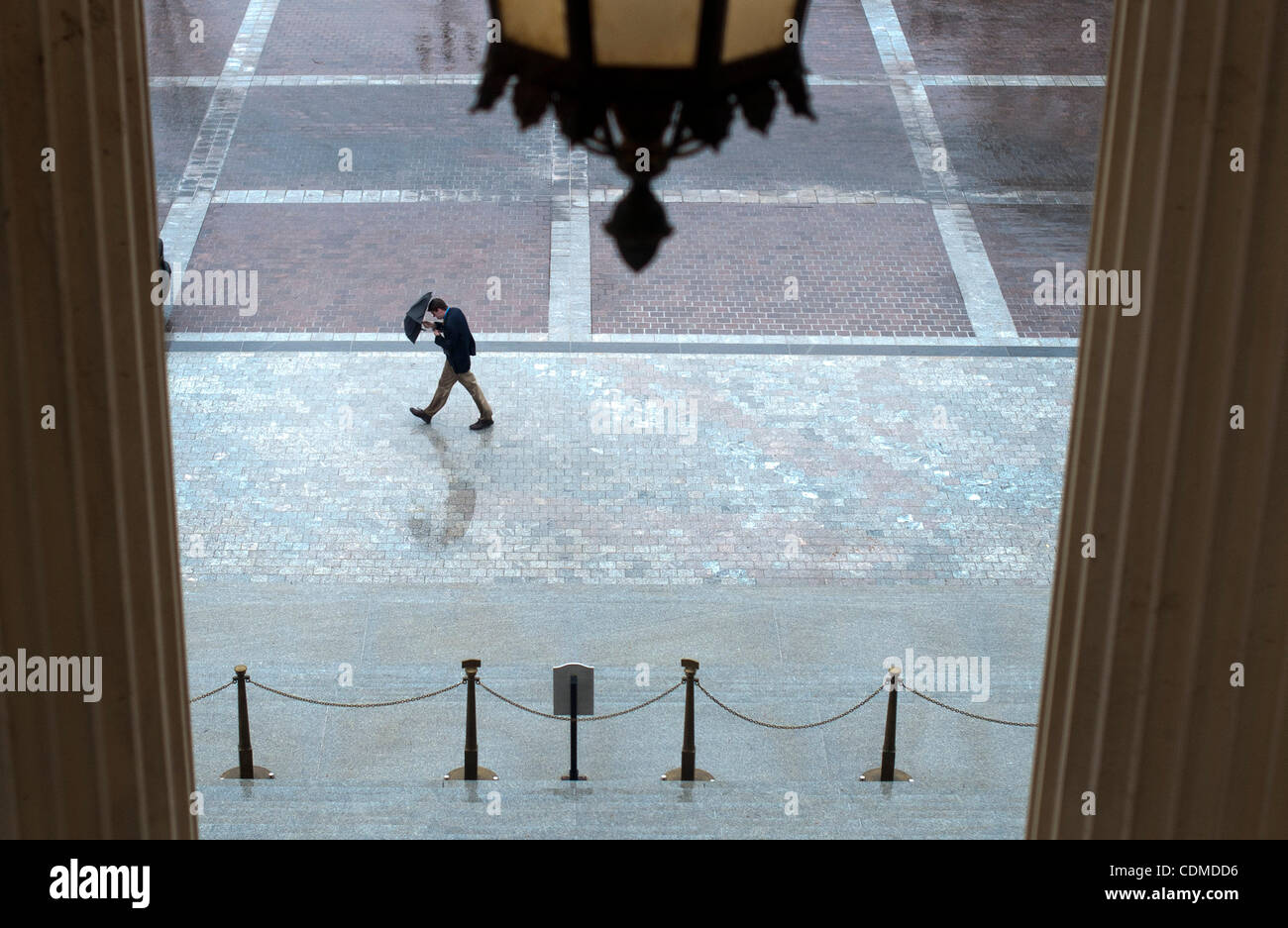 Apr. 5, 2011 - Washington, District of Columbia, U.S. - Workers and tourists make their way through the morning rain at the U.S. Capitol on Tuesday. (Credit Image: © Pete Marovich/ZUMAPRESS.com) Stock Photo