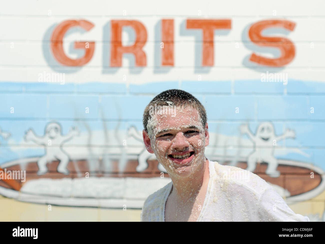 Apr. 9, 2011 - Warwick, GEORGIA, U.S. - Michael McDaniel, 15, of Warwick, Georgia, reacts after competing in the Grits Roll during the 14th annual National Grits Festival in Warwick, Georgia USA on 09 April 2011. McDaniel placed second in his division, gaining 84.5 pounds of grits. Grits, a food mad Stock Photo