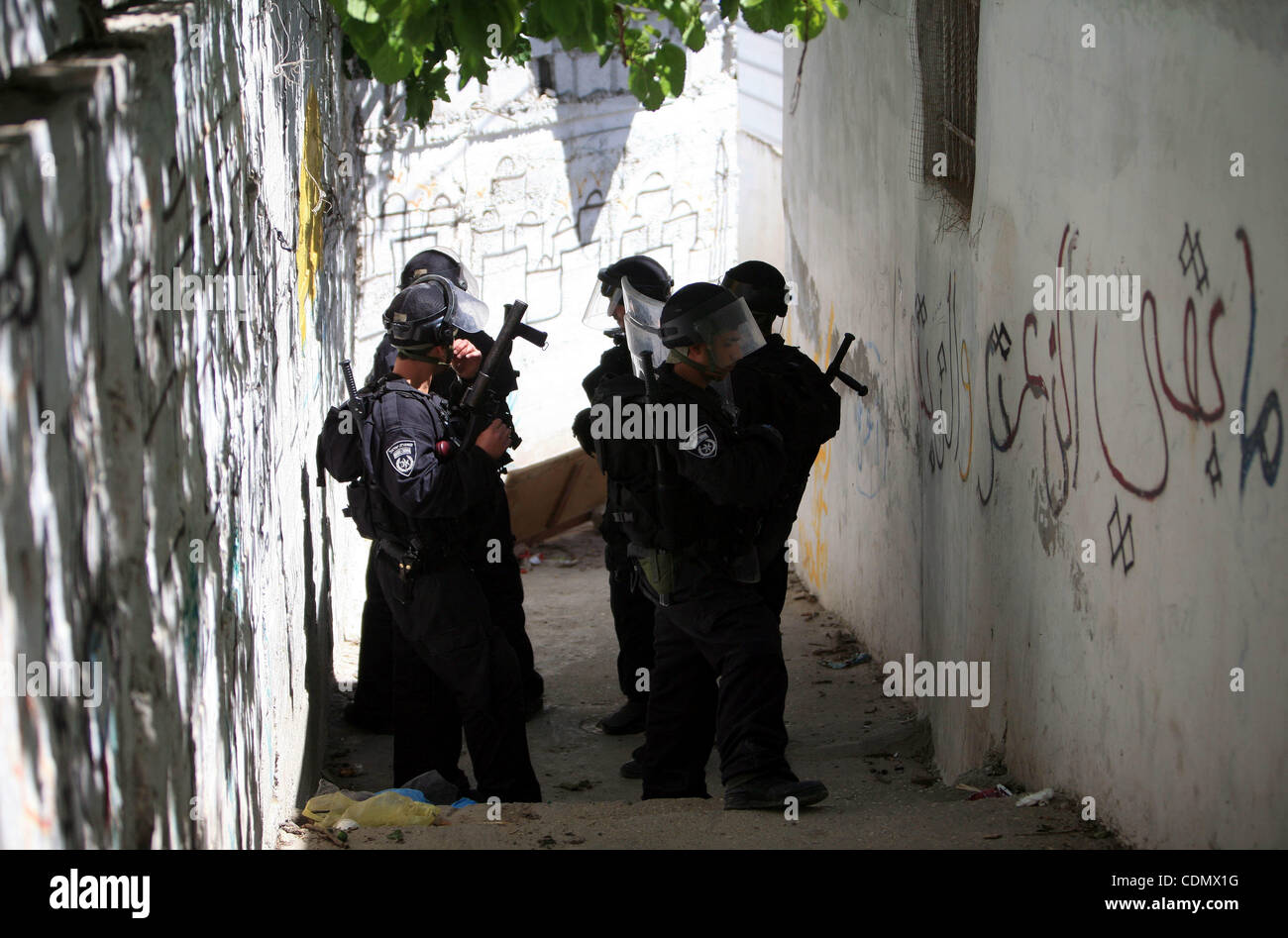 Israeli riot policemen take position in the east Jerusalem neighborhood of Silwan on April 15, 2011 following brief clashes between police and stone throwers. Photo by Sliman Khader Stock Photo