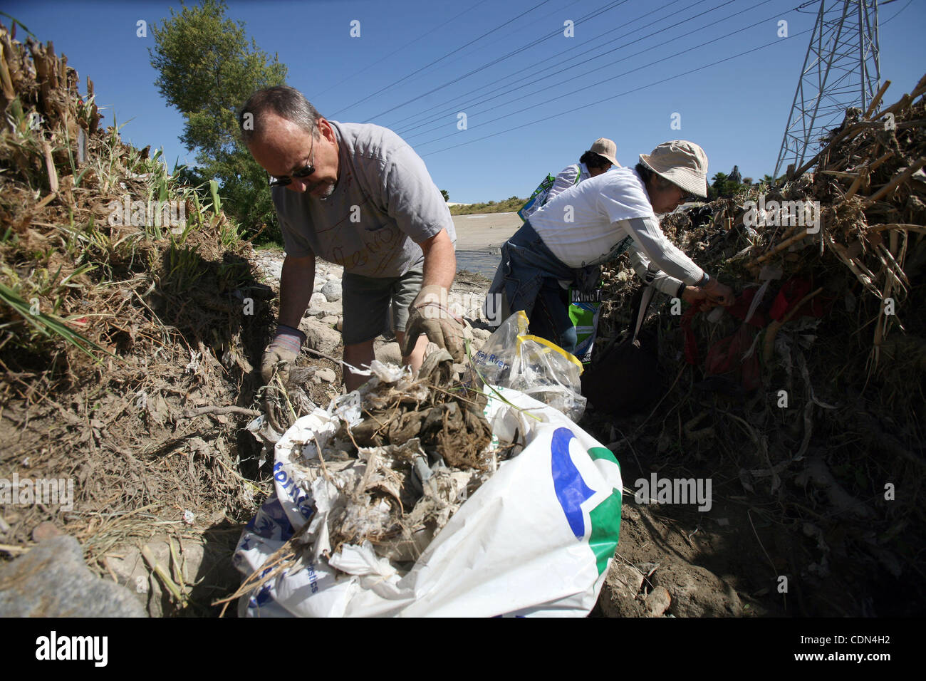 Volunteers pick up the trash in the Los Angeles River during the event