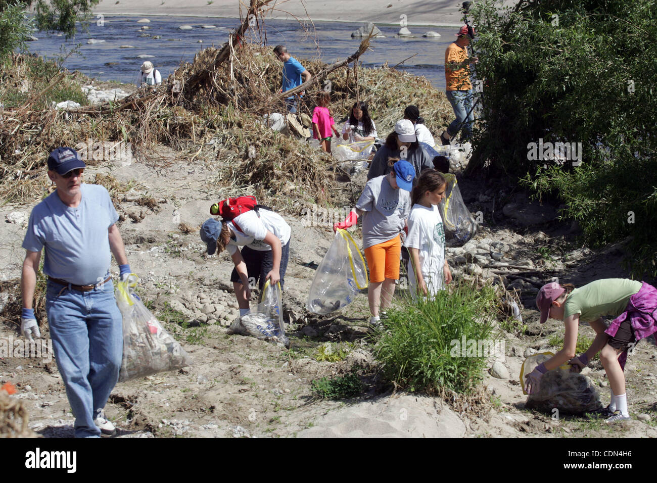 Volunteers pick up the trash in the Los Angeles River during the event