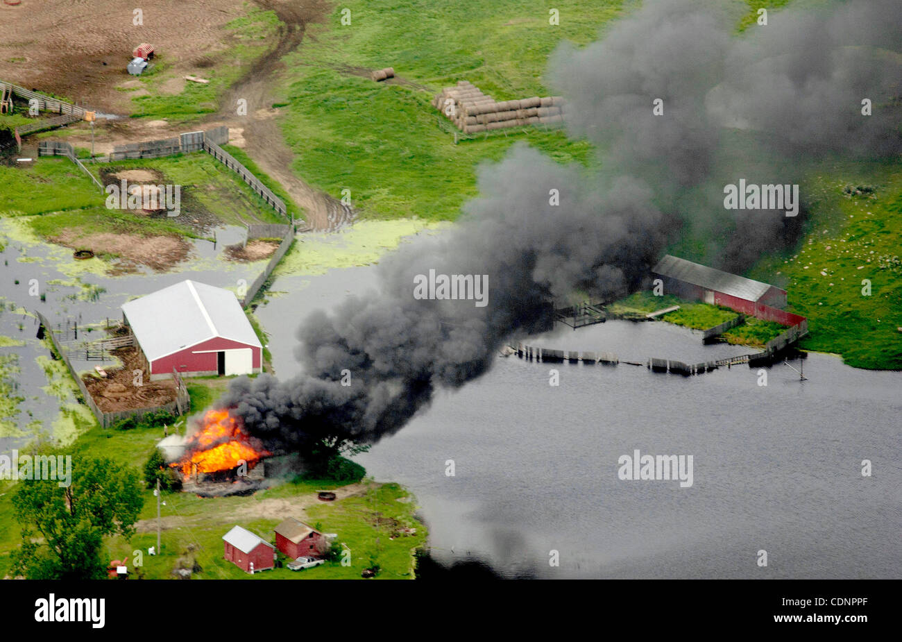 June 26, 2011 Max, North Dakota, U.S. An outbuilding burns Sunday