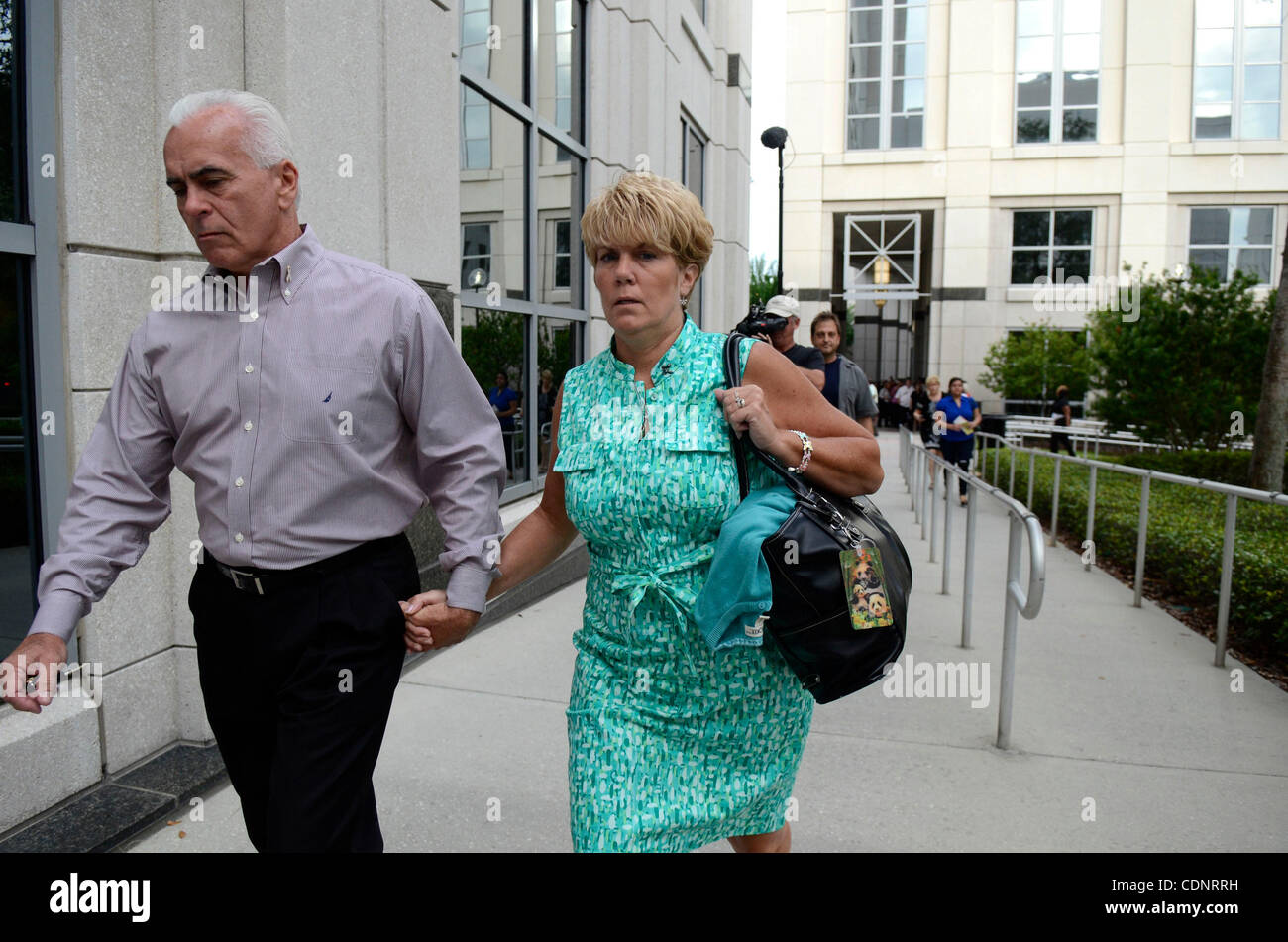 June 27, 2011 - Orlando, Florida, U.S. - GEORGE ANTHONY, left, and CINDY ANTHONY, parents of Casey Anthony, walk to the entrance of the Orange County Courthouse during the Casey Anthony murder trial. Casey Anthony is charged with killing her two-year-old daughter Caylee in 2008. (Credit Image: &#169 Stock Photo