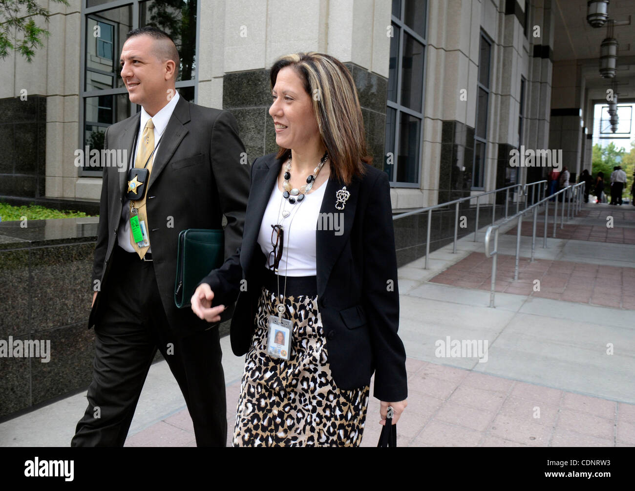 June 27, 2011 - Orlando, Florida, U.S. - Orange County homicide detective YURI MELICH, left, and legal assistant ARLEEN ZAYAS walk to the entrance of the Orange County Courthouse during the Casey Anthony murder trial. Casey Anthony is charged with killing her two-year-old daughter Caylee in 2008. (C Stock Photo
