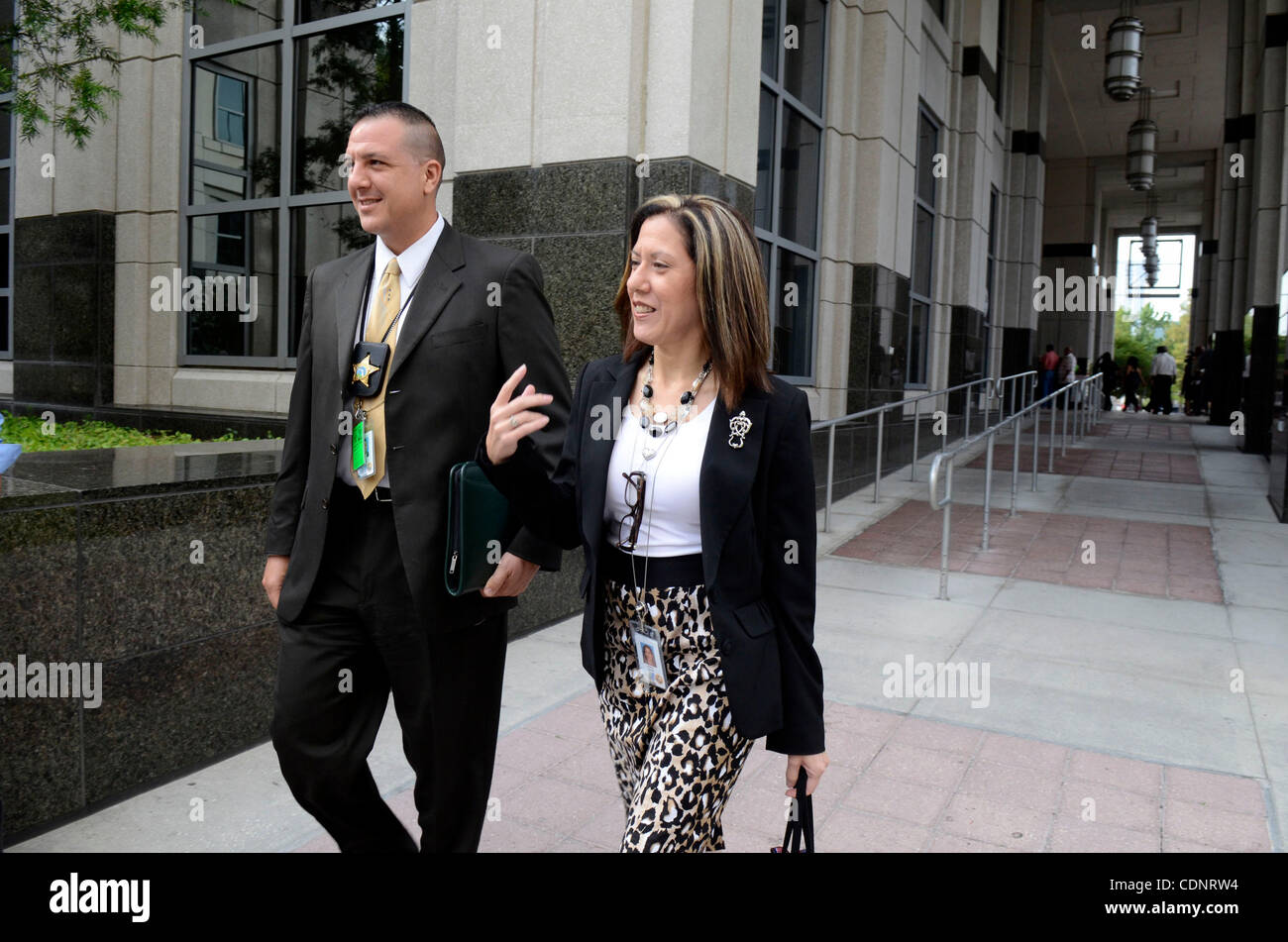 June 27, 2011 - Orlando, Florida, U.S. - Orange County homicide detective YURI MELICH, left, and legal assistant ARLEEN ZAYAS walk to the entrance of the Orange County Courthouse during the Casey Anthony murder trial. Casey Anthony is charged with killing her two-year-old daughter Caylee in 2008. (C Stock Photo
