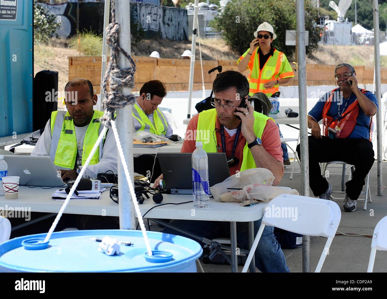 JULY 16,2011- Los Angeles, California, USA.  Camp 405 news media reporters as they cover the construction teams work on the demolishing the Mulholland Dr. bridge over the 405 freeway on the first day of carmageddon. (Credit Image: © Gene Blevins/ZUMAPRESS.com) Stock Photo
