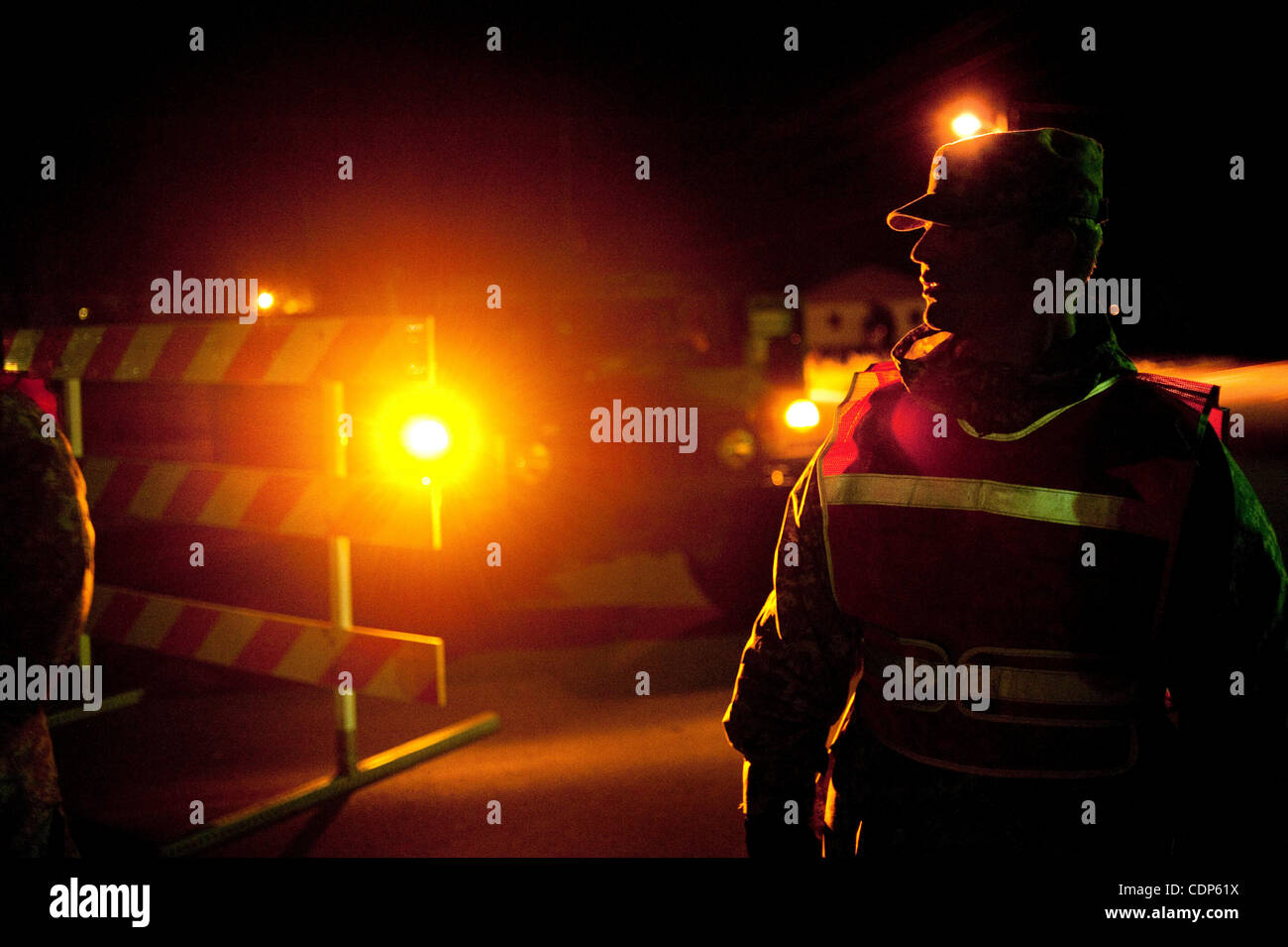 April 27, 2011 - Poplar Bluff, Missouri, U.S. - Private First Class DAKOTAH VERT, waits at a check point on Route 53 on Wednesday night. Checkpoints were set to reduce looting and to keep people out of dangerously flooded areas. Vert struggled with boredom during his 12 plus hour shift. (Credit Imag Stock Photo
