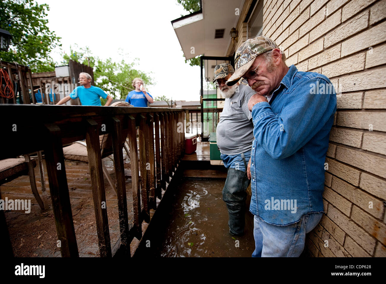 April 27, 2011 - Poplar Bluff, Missouri, U.S. - DALE CLAREDON and LARRY DOIRAN, inspect the damage done to Doiran's porch on N. 2nd St.. Doiran's friends and family came back to his home on Wednesday to help him assess the damage and save as much food as possible. (Credit Image: © Grant Hindsley/zRe Stock Photo