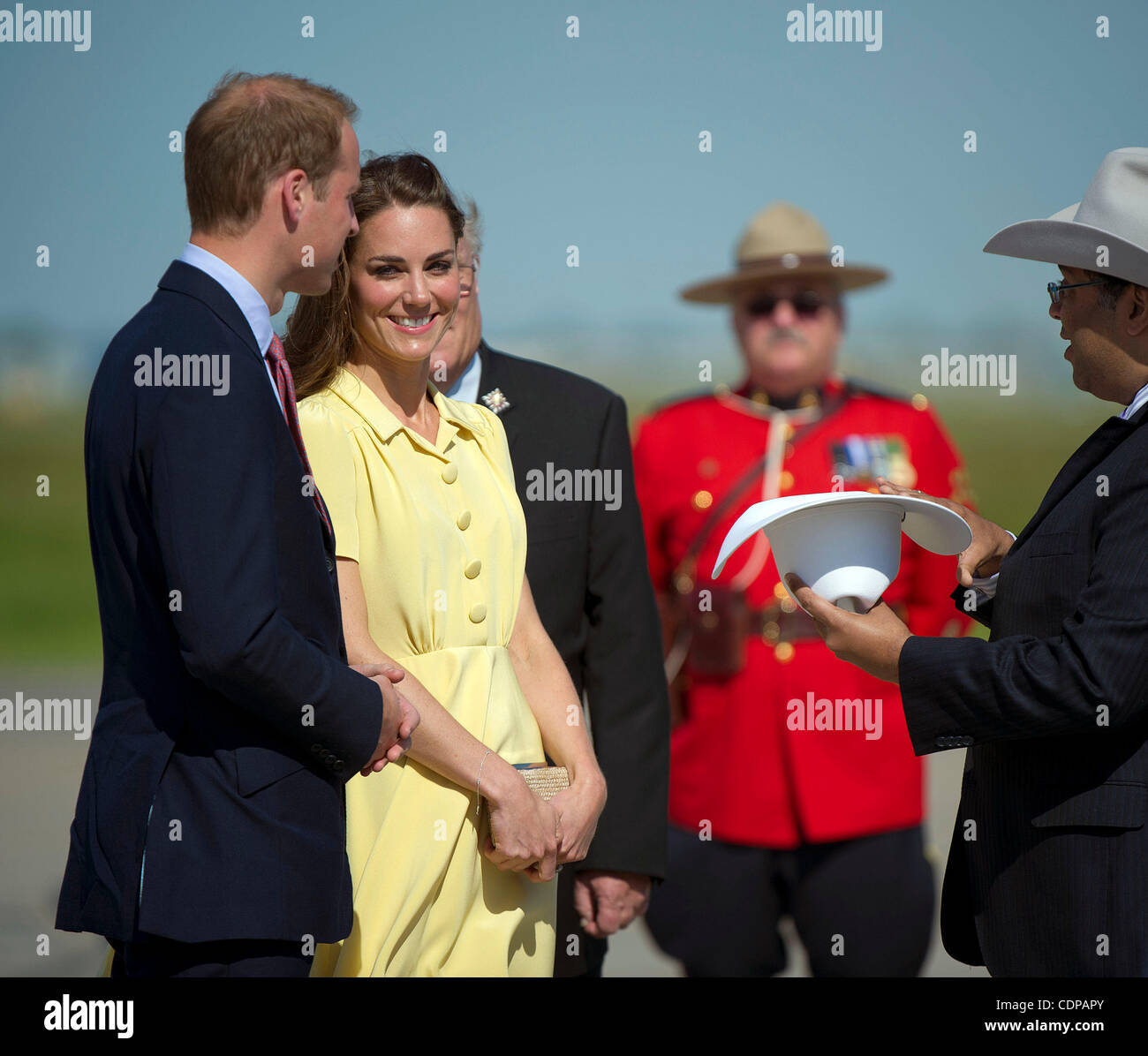 July 7, 2011 - Calgary, Alberta, Canada - Prince William and Catherine Middleton, Duchess of Cambridge, are greeted with white cowboy hats by Calgary Mayor Nenshi, as they arrive in Calgary. Calgary is the last Canadian stop of the British Royal Tour. Photo by Jimmy Jeong / Rogue Collective Stock Photo