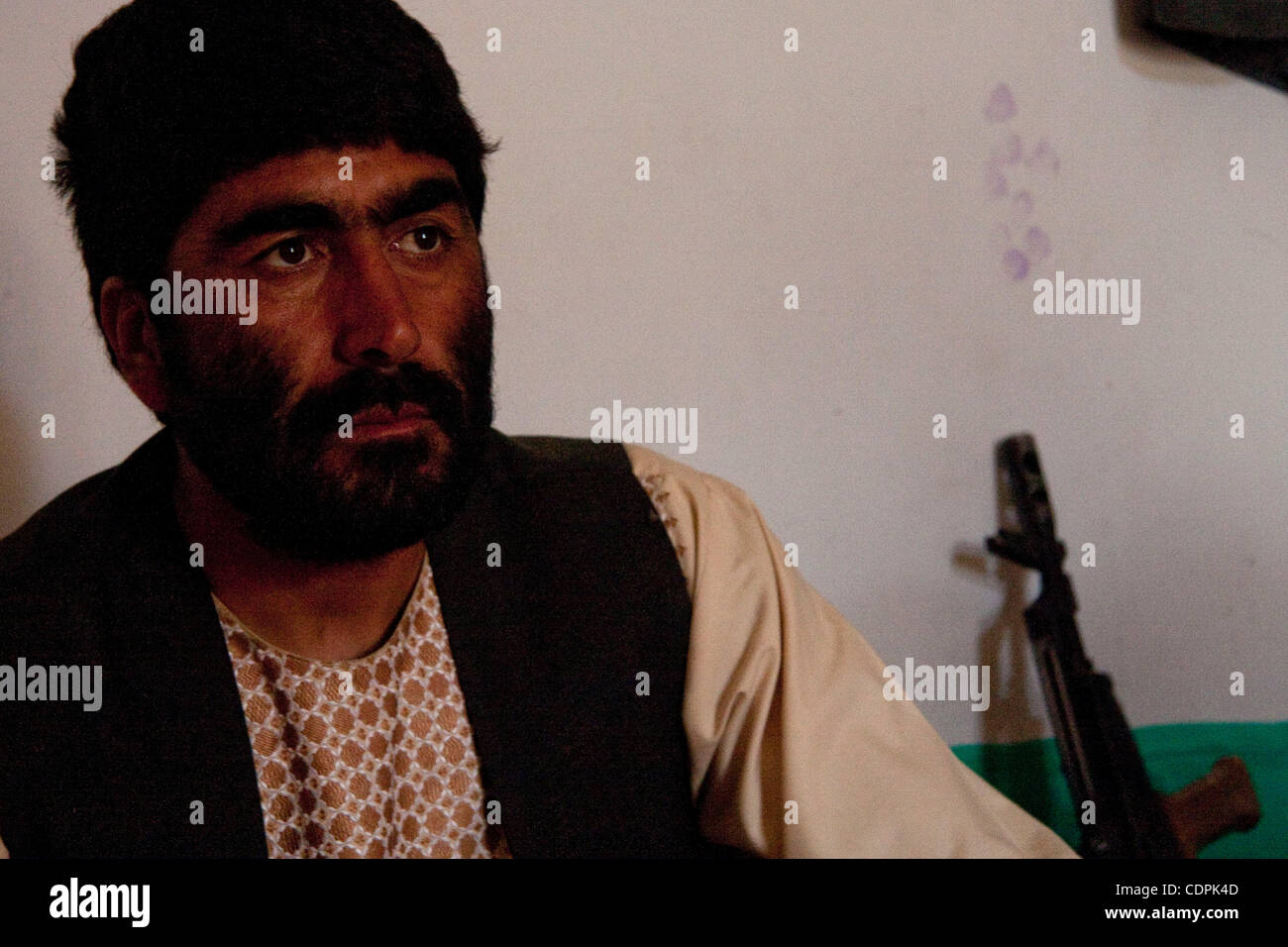 Apr 25, 2011 - Naw Zad, Helmand, Afghanistan - Naw Zad district Afghan National Police Chief ABDULLAH FARIDI, from the village of Surkano in the area sits in his office during a meeting with correspondents and U.S. Marines at the police headquarters in the town of Naw Zad in the Naw Zad district of Stock Photo