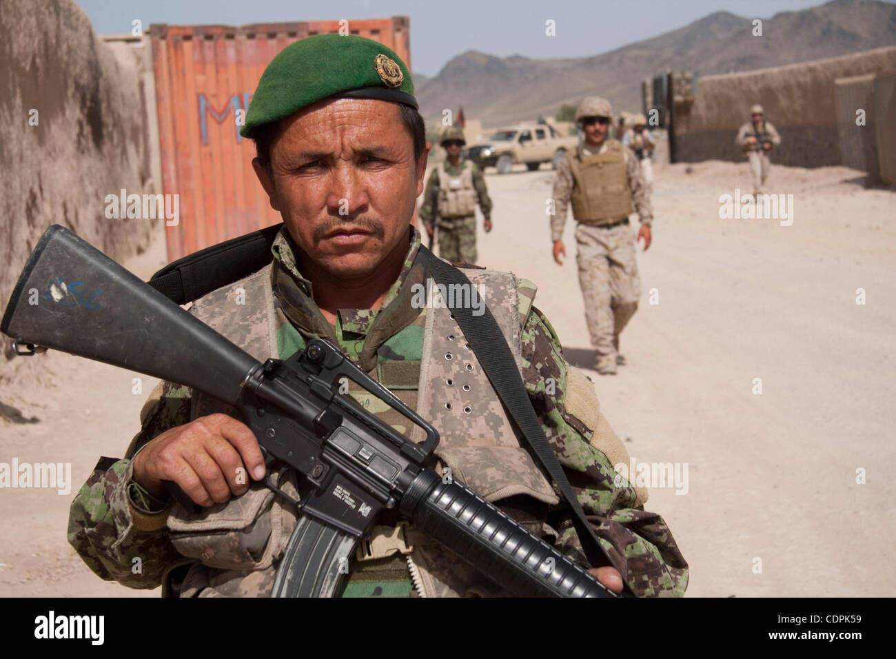 Apr 27, 2011 - Town of Naw Zad, Naw Zad district, Helmand, Afghanistan - An ANA soldier from 4th Company, 3rd Kandak, 2nd Brigade of 215th Afghan National Army Corps patrols the Bazar of Naw Zad in Naw Zad district in Helmand province. While security in the area has gotten better in comparison to la Stock Photo