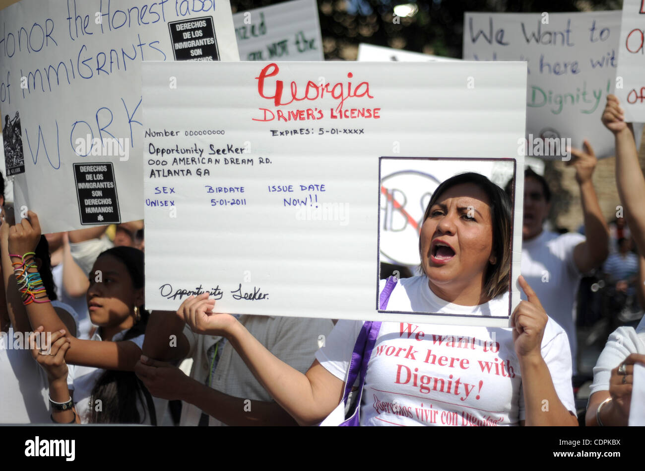 May 1, 2011 - Atlanta, GEORGIA, U.S. - Veronica Islas holds up a mock Georgia driver's license during a May Day worker rally at the State Capitol in Atlanta, Georgia USA on 01 May 2011. Participants urged Georgia Governor Nathan Deal to veto an Arizona style immigration bill which has passed the Geo Stock Photo