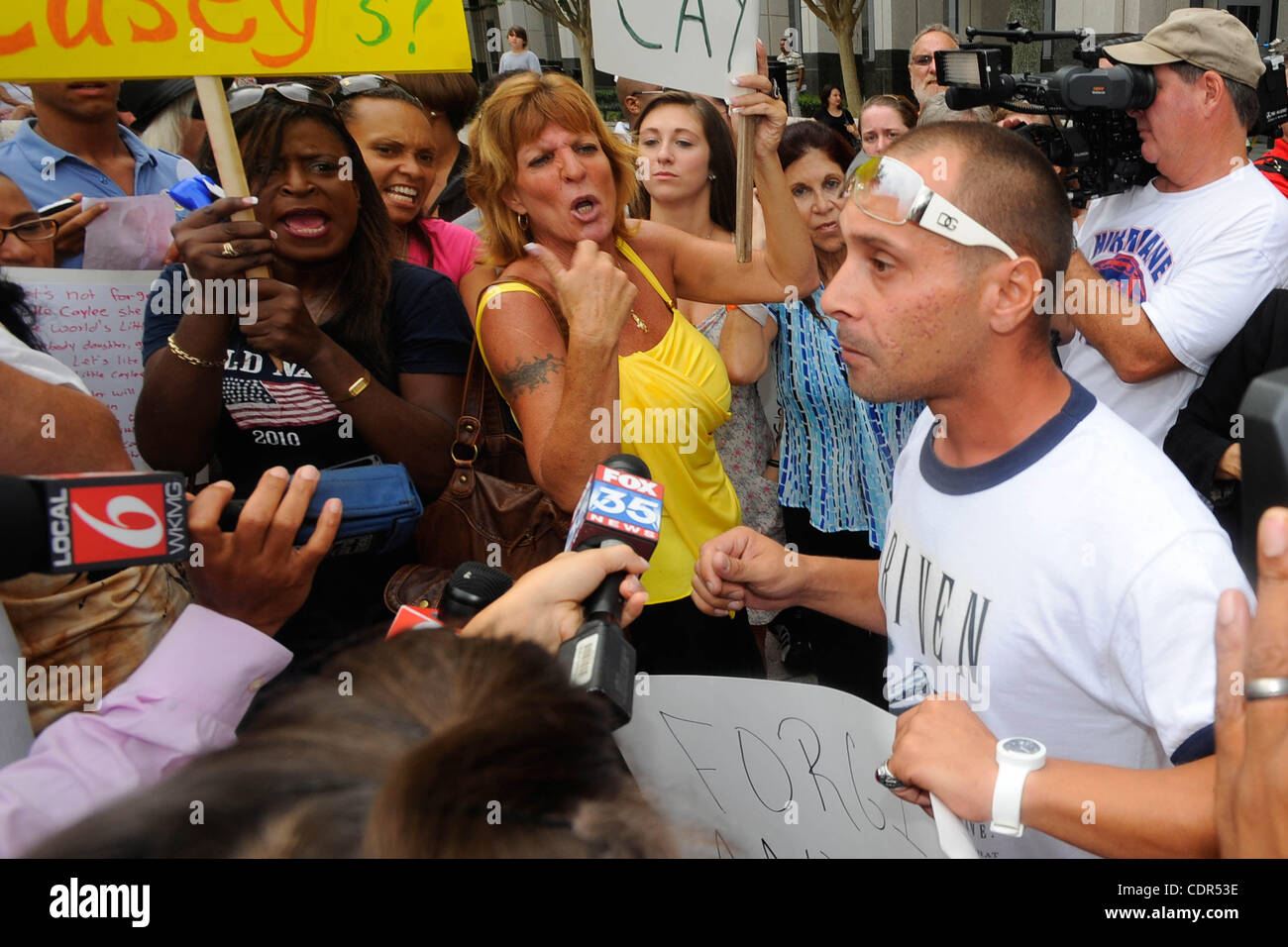 A pro-Casey Anthony supporter is shouted down by anti-Anthony protesters during sentencing outside the Orange County July 7, 2011 in Orlando, FL.  (J.B. Skipper/ZUMA) Stock Photo