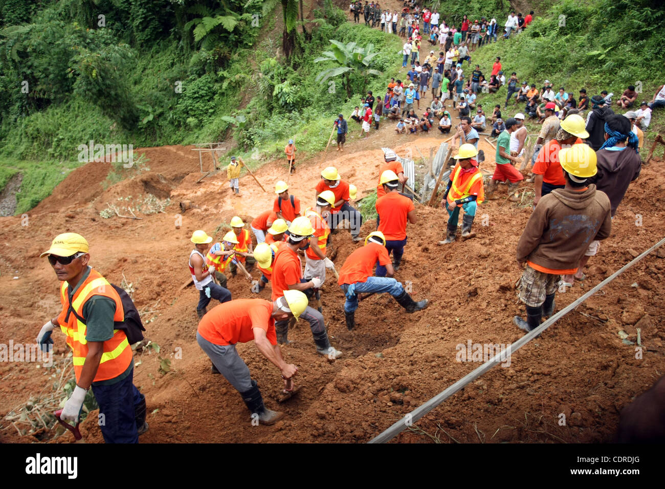 Apr 23, 2011 - Pantukan, Compostella Valley, Philippines - Rescuers search for missing people Saturday after an avalanche of mud buried an illegal gold mining camp on Friday. Officials say at least three bodies have been recovered so far and 15 have been rescued, while 21 people are still missing. ( Stock Photo