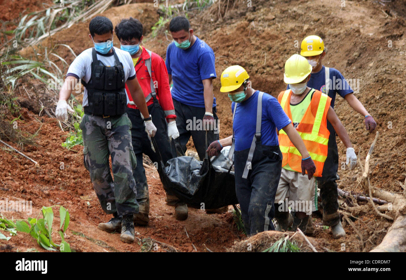 Philippine Rescuer Model Apr 25, 2011 - Kingking, Compostella, Philippine - Rescuers carry a ...
