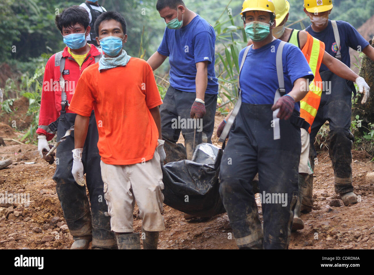 Philippine Rescuer Model Apr 25, 2011 - Kingking, Compostella, Philippine - Rescuers carry a ...